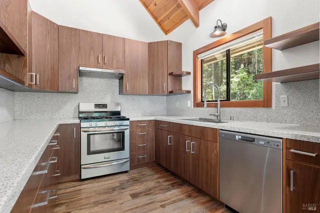 a kitchen with a sink and wooden cabinets