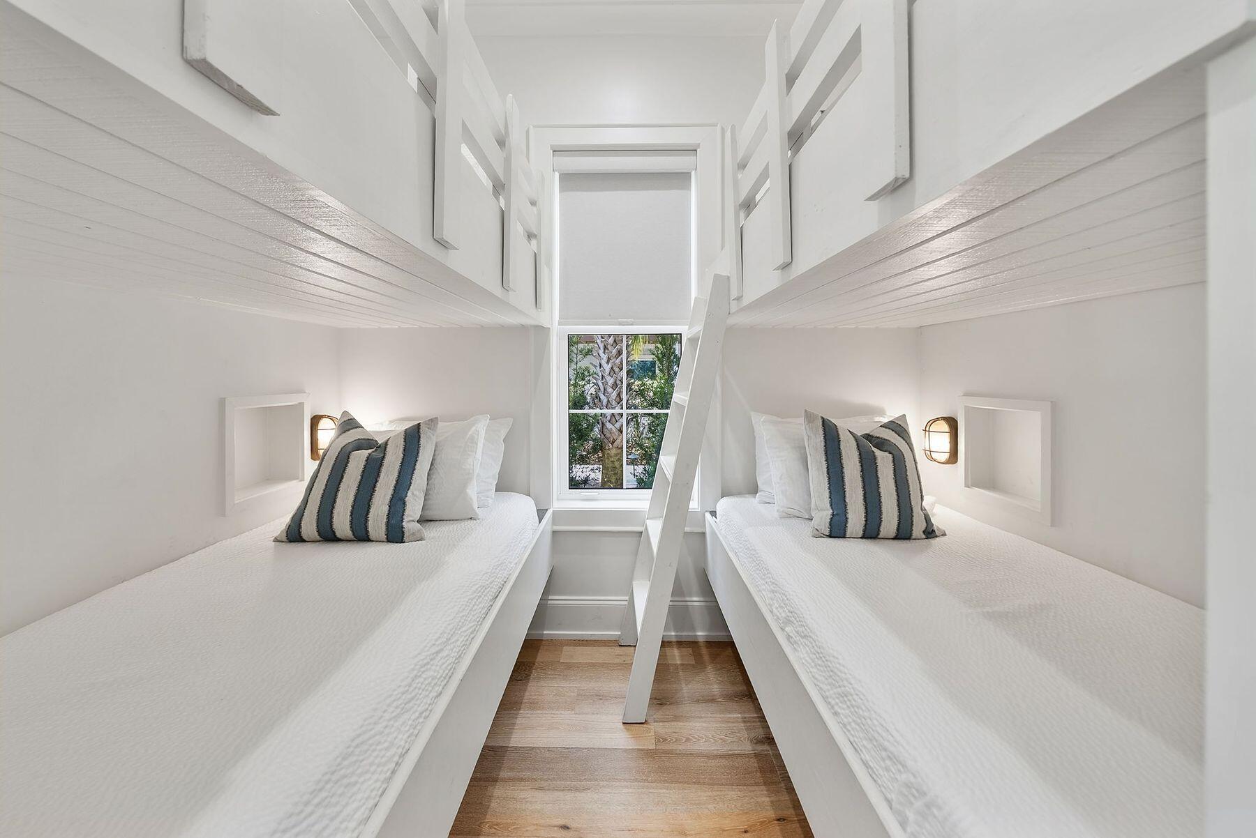 8183 East County Highway 30A Inlet Beach, FL 32461 - Photo 13 of 63 a bedroom with a large bed and a walk in closet