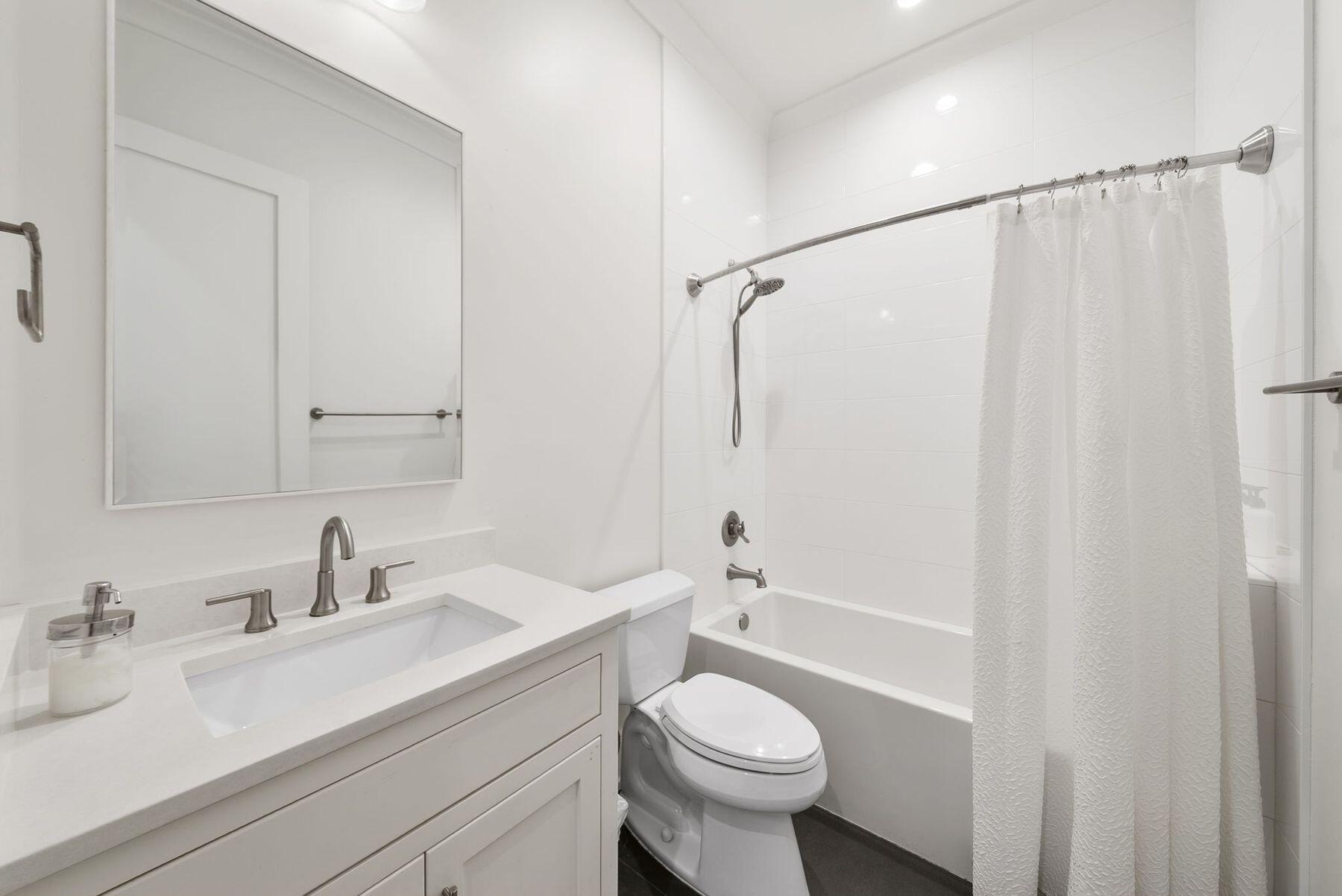 8183 East County Highway 30A Inlet Beach, FL 32461 - Photo 14 of 63 a bathroom with a sink toilet a mirror and shower