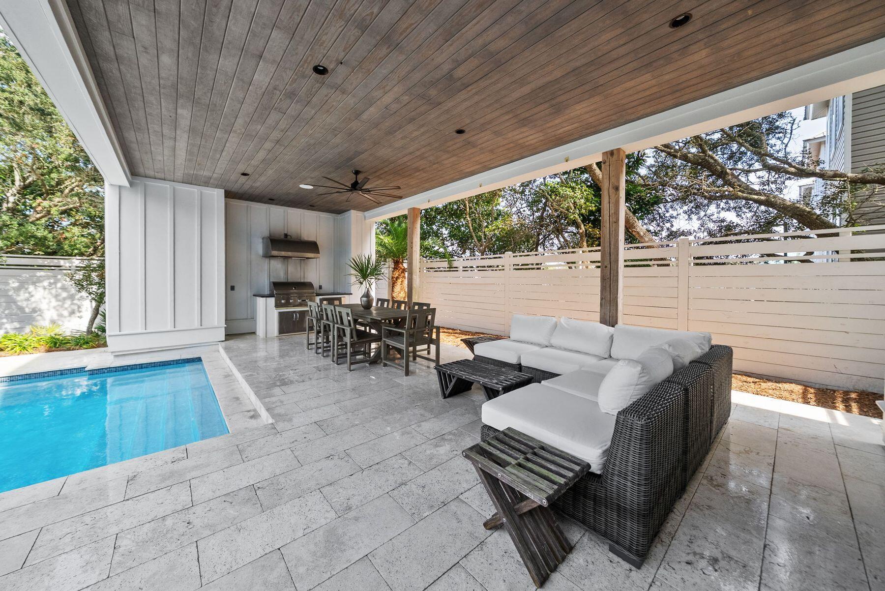 8183 East County Highway 30A Inlet Beach, FL 32461 - Photo 18 of 63 a outdoor space with patio the couches and a dining table with garden view