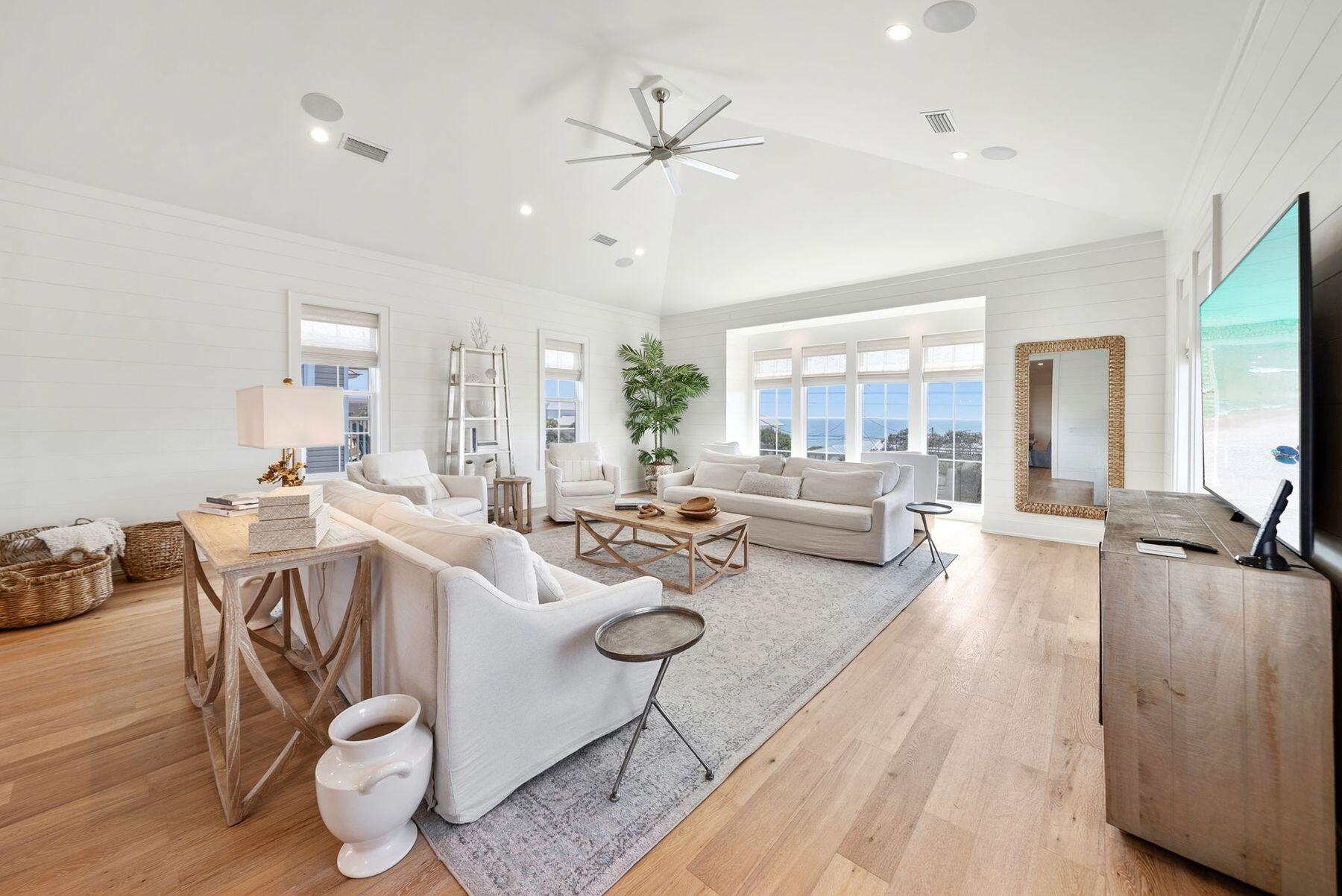 8183 East County Highway 30A Inlet Beach, FL 32461 - Photo 2 of 63 a living room with furniture a large window and wooden floor