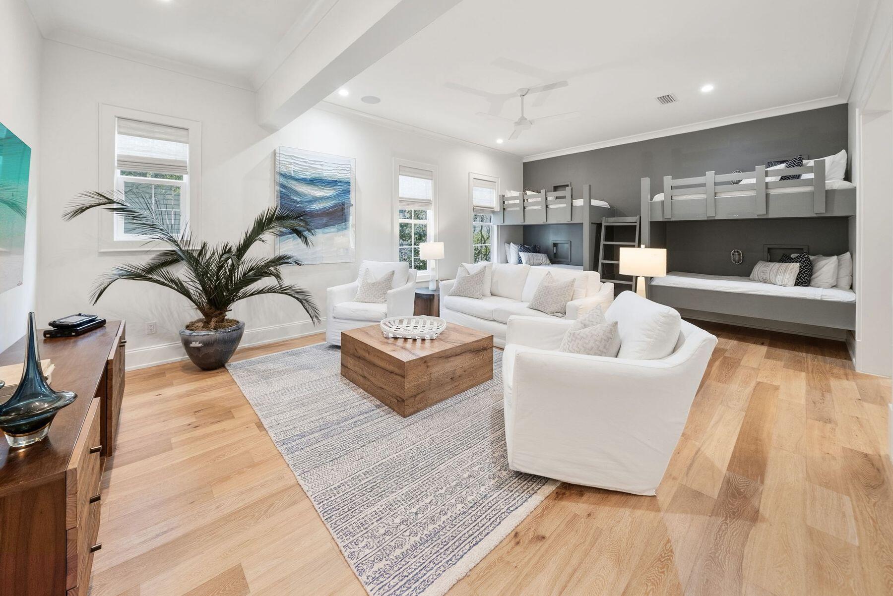 8183 East County Highway 30A Inlet Beach, FL 32461 - Photo 22 of 63 a living room with fireplace furniture and a wooden floor