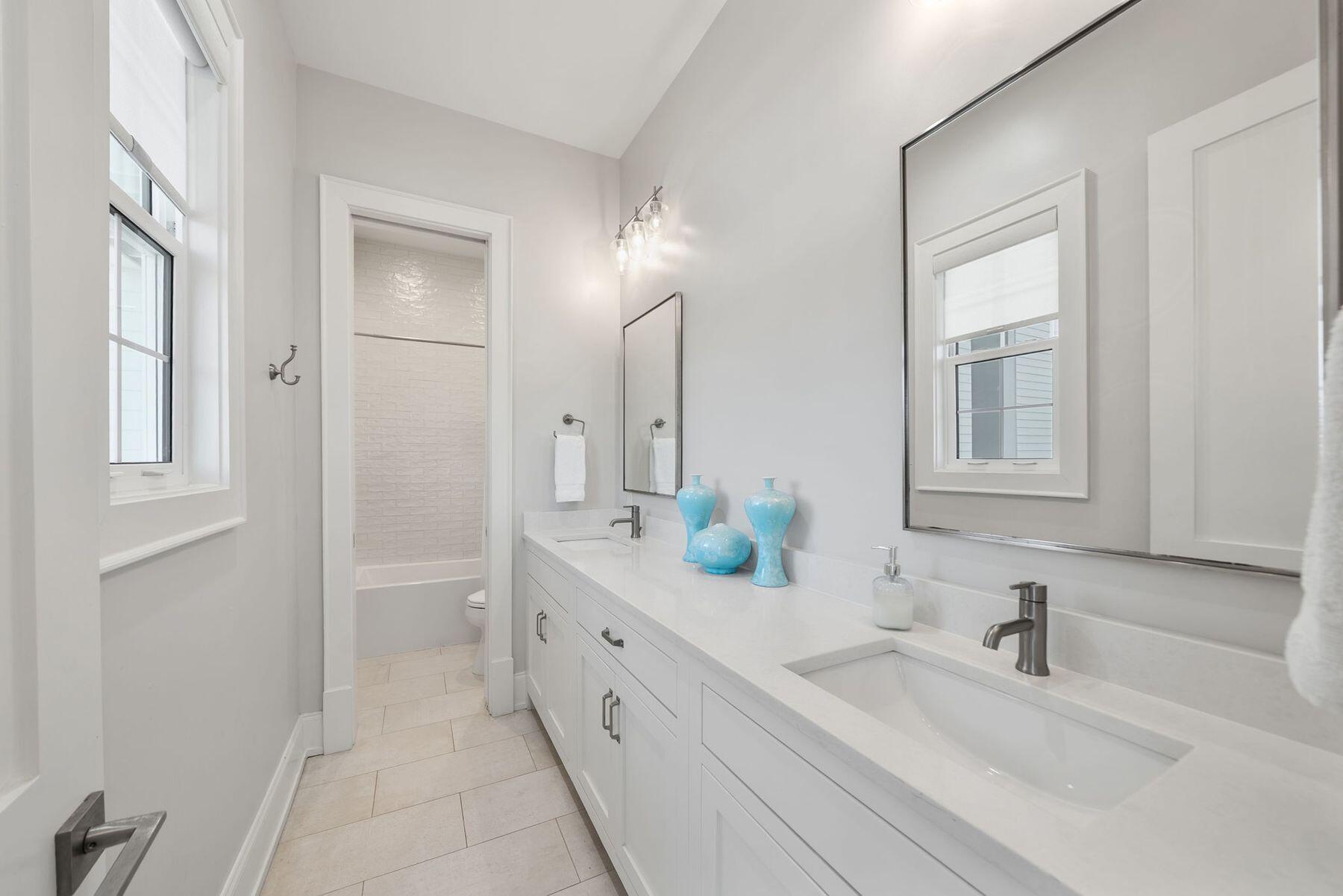 8183 East County Highway 30A Inlet Beach, FL 32461 - Photo 32 of 63 a bathroom with a double vanity sink mirror and double