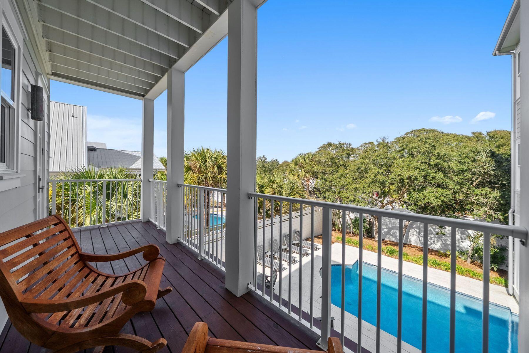 8183 East County Highway 30A Inlet Beach, FL 32461 - Photo 34 of 63 a view of a chair and table in the balcony