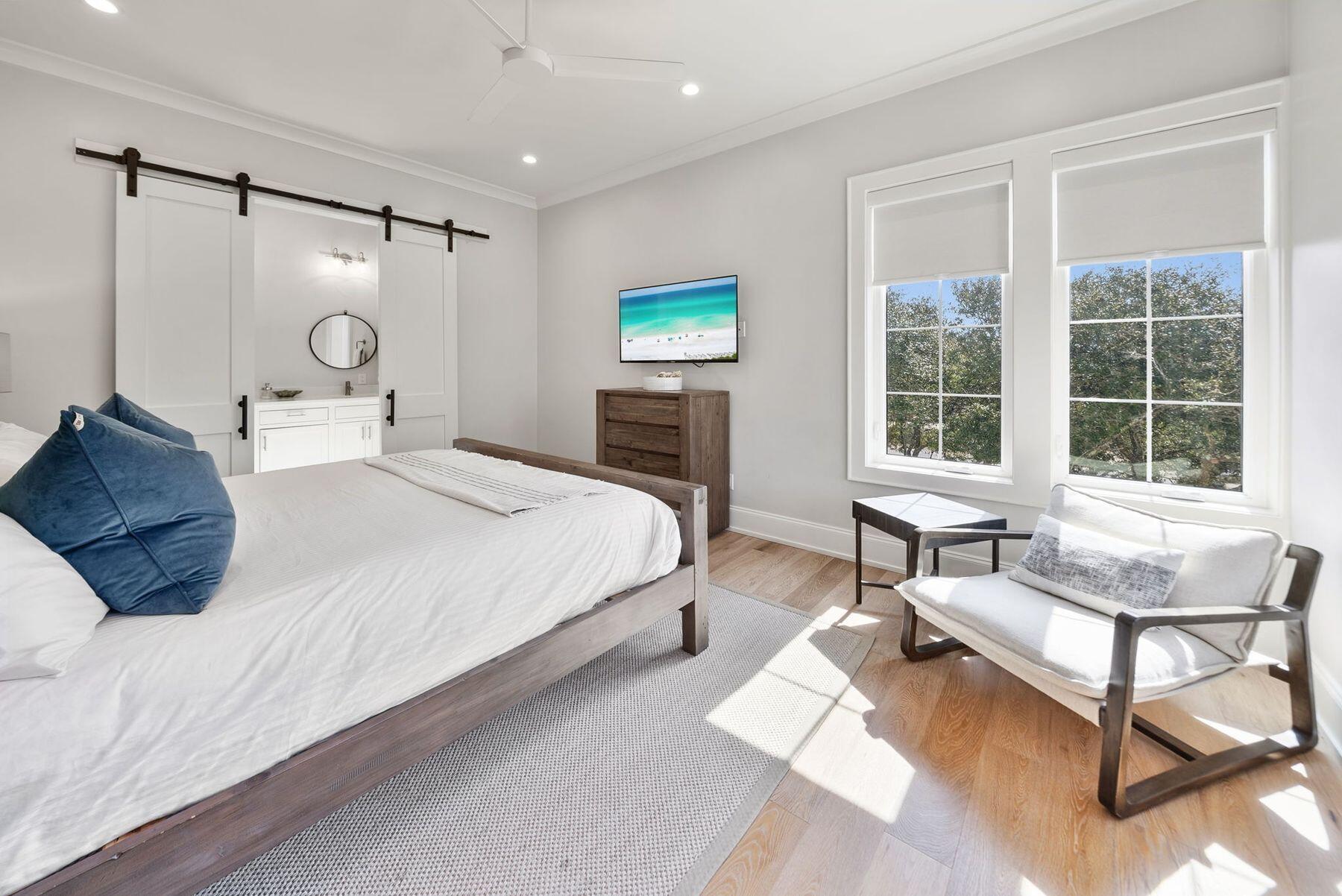 8183 East County Highway 30A Inlet Beach, FL 32461 - Photo 36 of 63 a bedroom with a bed and a window