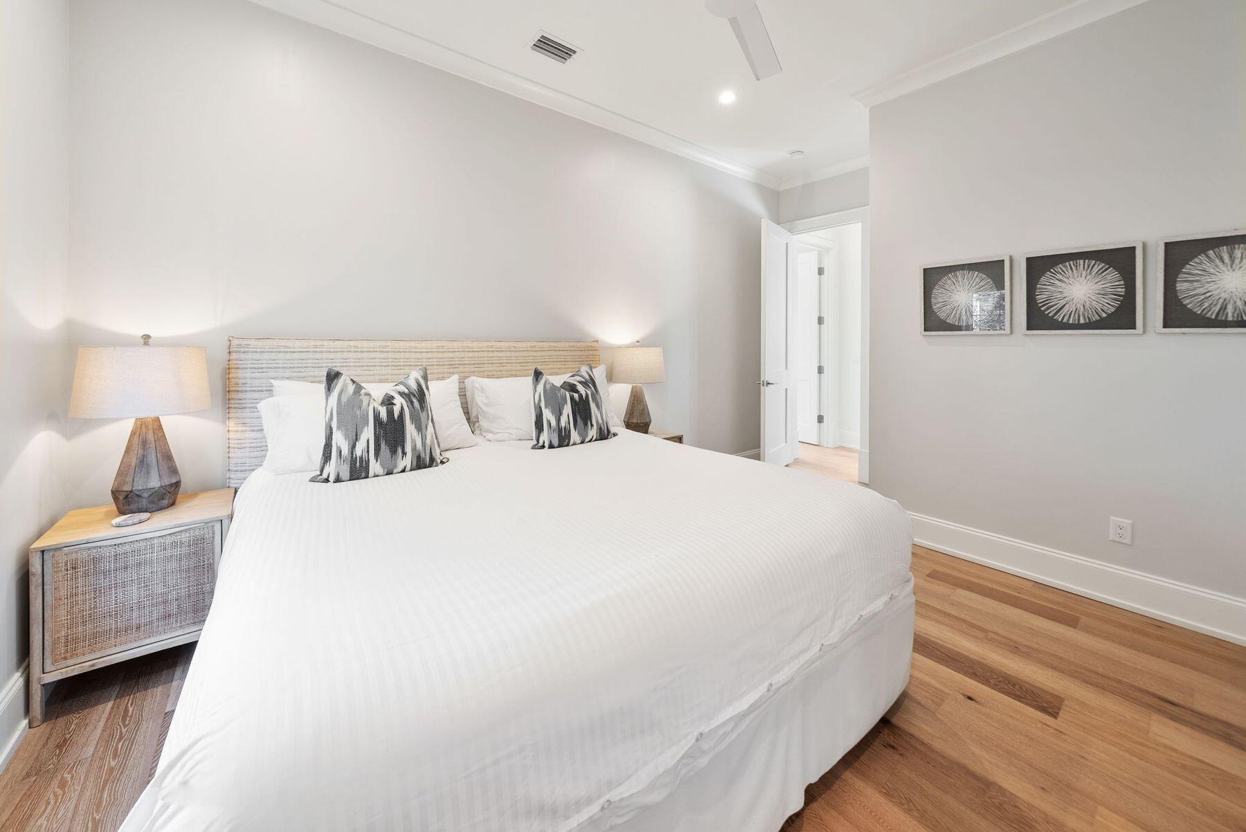 8183 East County Highway 30A Inlet Beach, FL 32461 - Photo 38 of 63 a spacious bedroom with a bed and a couch