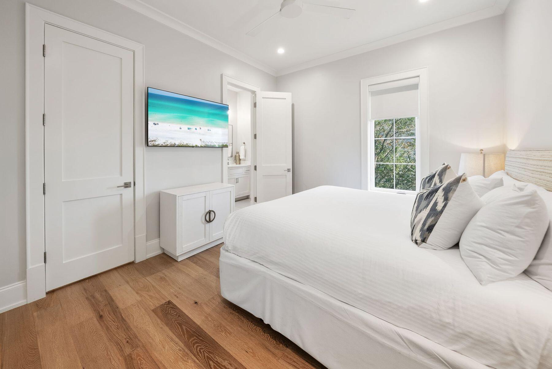 8183 East County Highway 30A Inlet Beach, FL 32461 - Photo 39 of 63 a large white bed in a white room