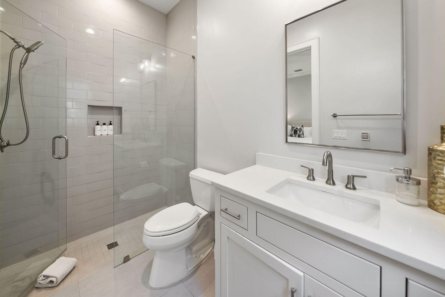 8183 East County Highway 30A Inlet Beach, FL 32461 - Photo 40 of 63 a bathroom with a sink a toilet and shower