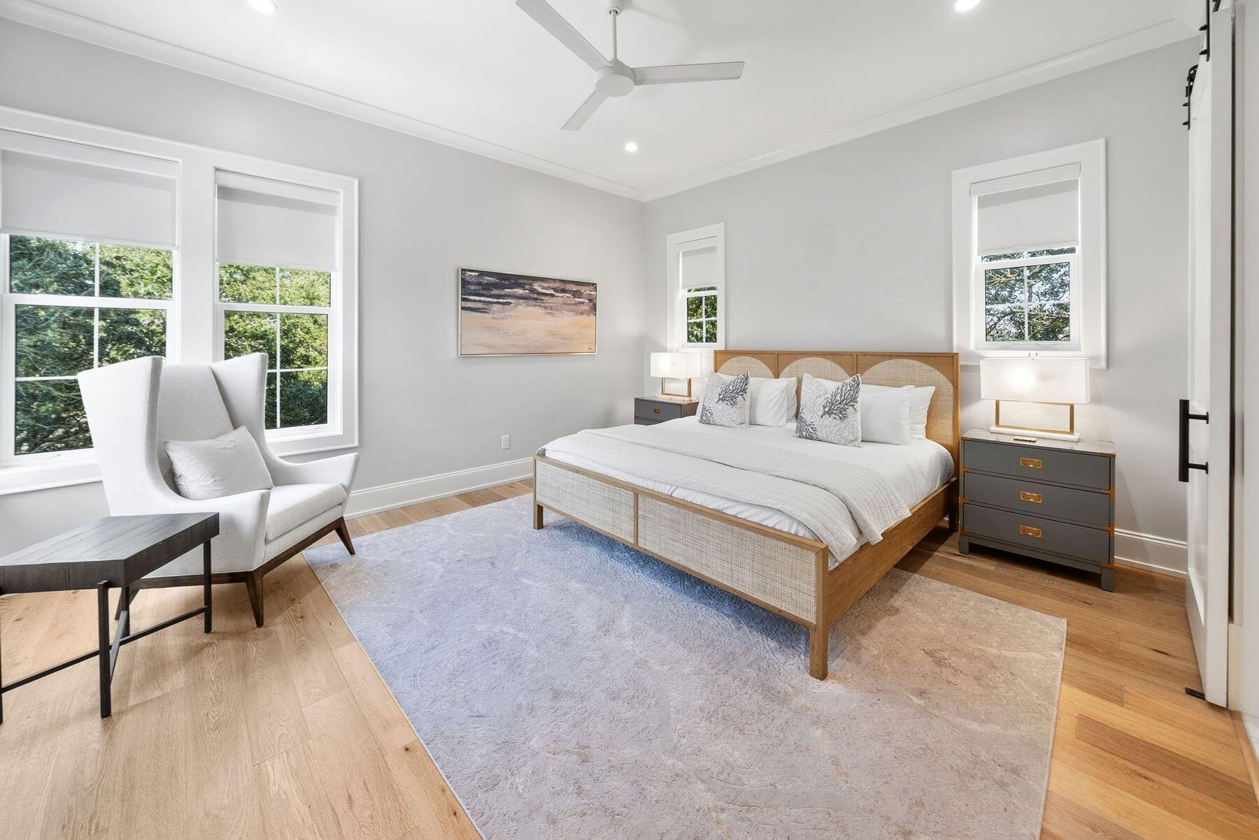 8183 East County Highway 30A Inlet Beach, FL 32461 - Photo 52 of 63 a bedroom with a bed wooden floor and a table