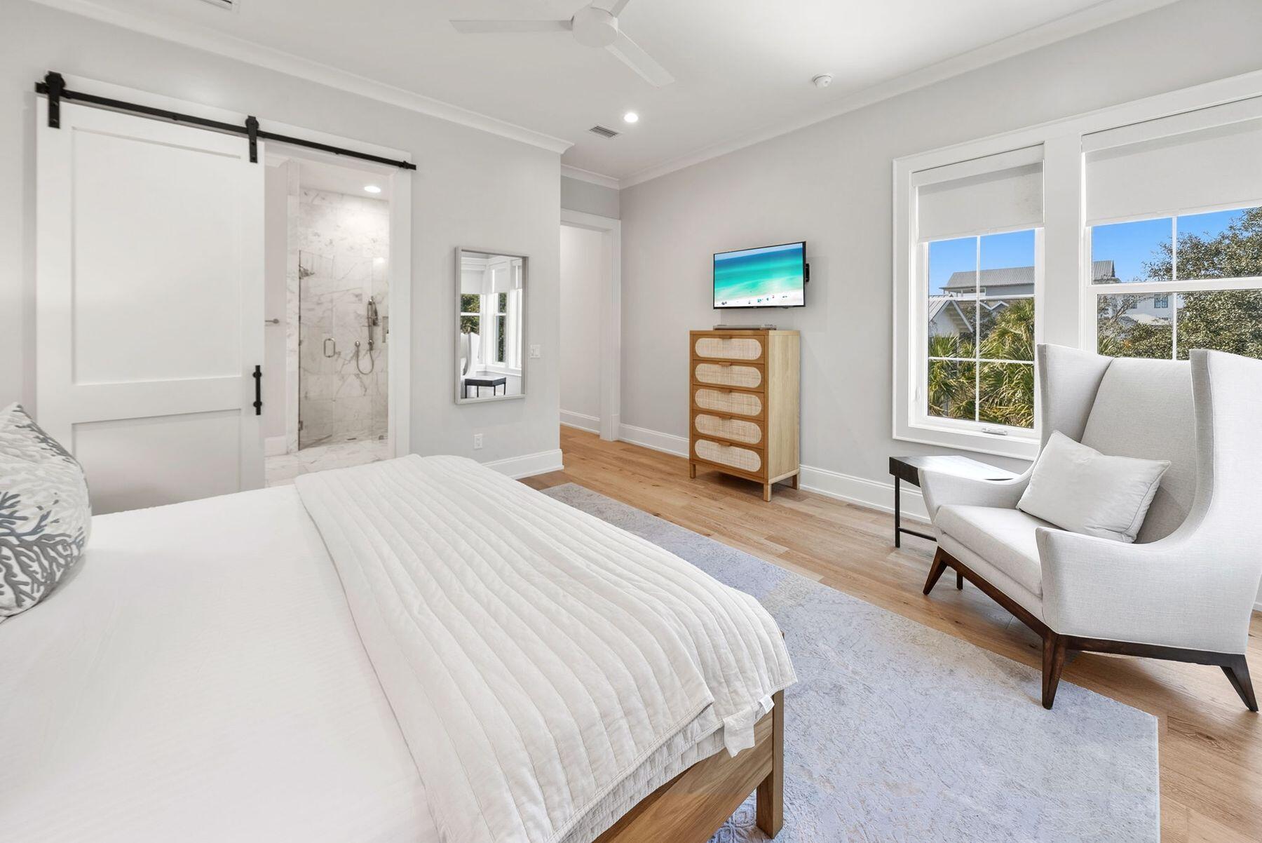 8183 East County Highway 30A Inlet Beach, FL 32461 - Photo 53 of 63 a spacious bedroom with a bed and a couch