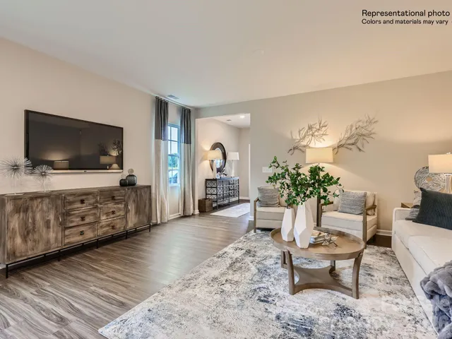 a kitchen with stainless steel appliances a stove a sink a stove a refrigerator cabinets and dining table