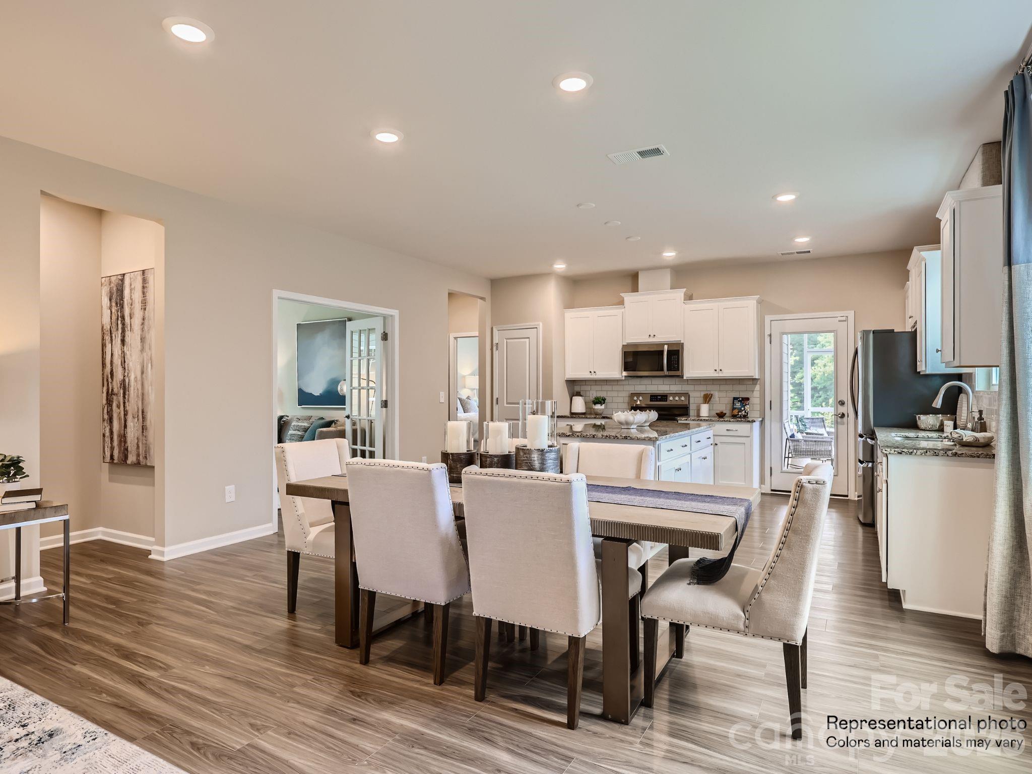 3326 Amarillo Court Lancaster, SC 29720 - Photo 7 of 19 a view of a dining room with furniture and wooden floor
