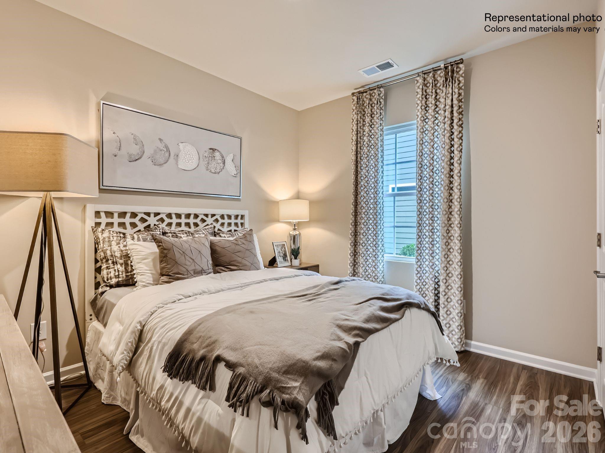 3326 Amarillo Court Lancaster, SC 29720 - Photo 9 of 19 a bedroom with a bed and a painting on the wall