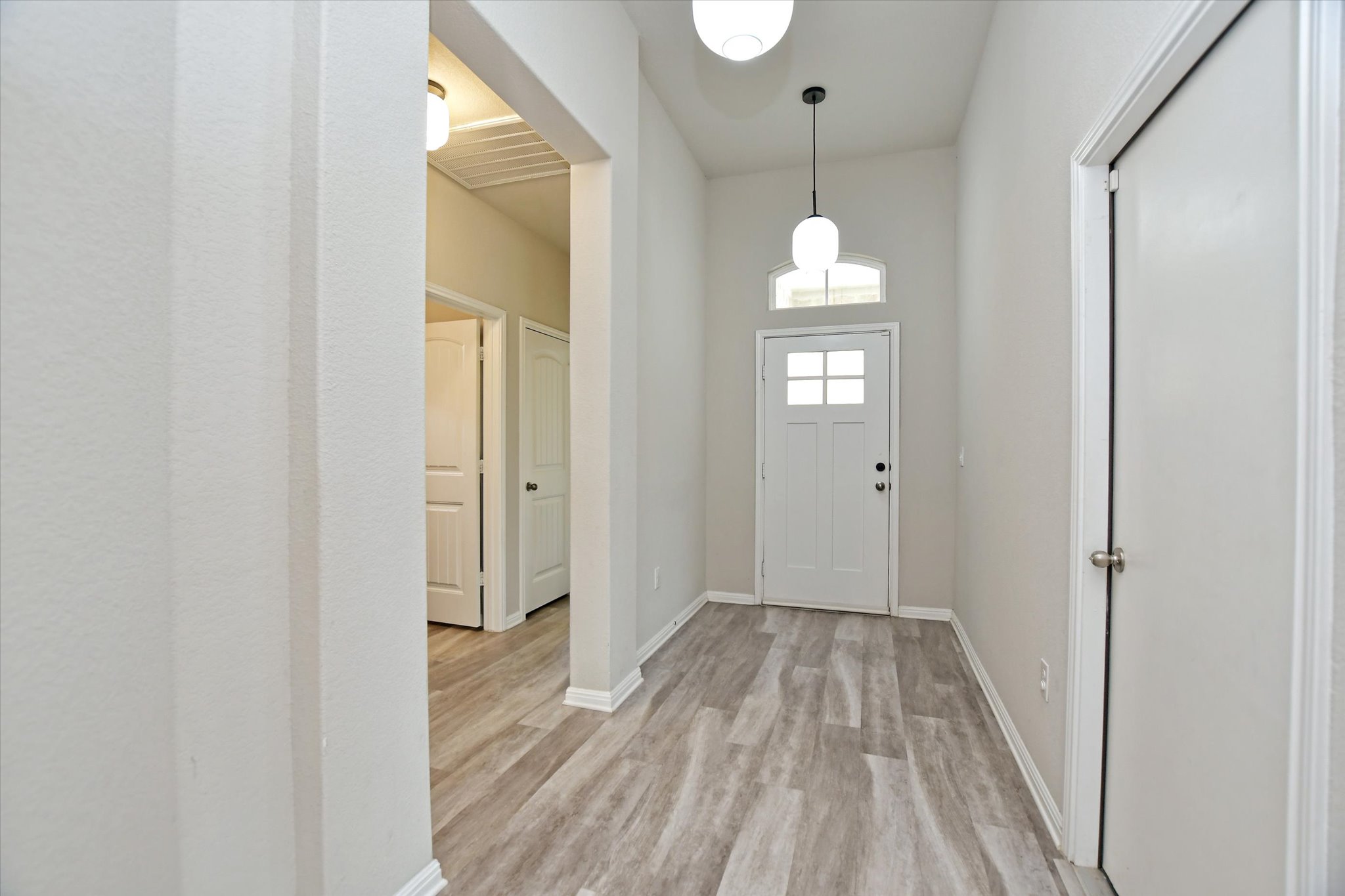 4300 Porter Farm Road Georgetown, TX 78628 - Photo 8 of 36 A welcoming entryway with durable plank flooring sets a practical, refined tone for daily living.