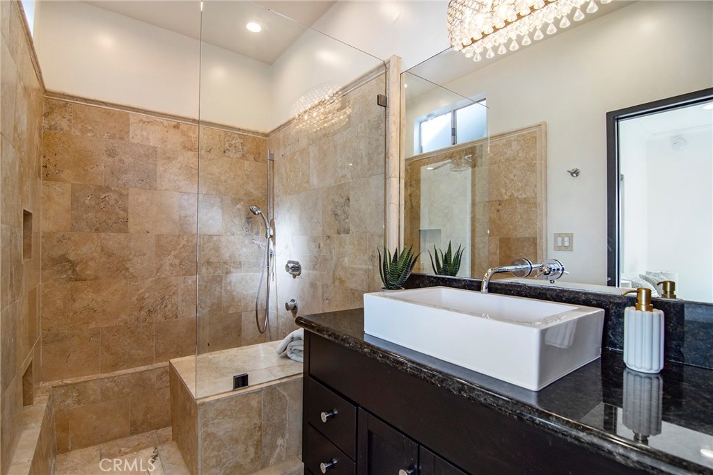 959 North Doheny Drive, Unit 205 West Hollywood, CA 90069 - Photo 17 of 25 a spacious bathroom with a bathtub and a sink