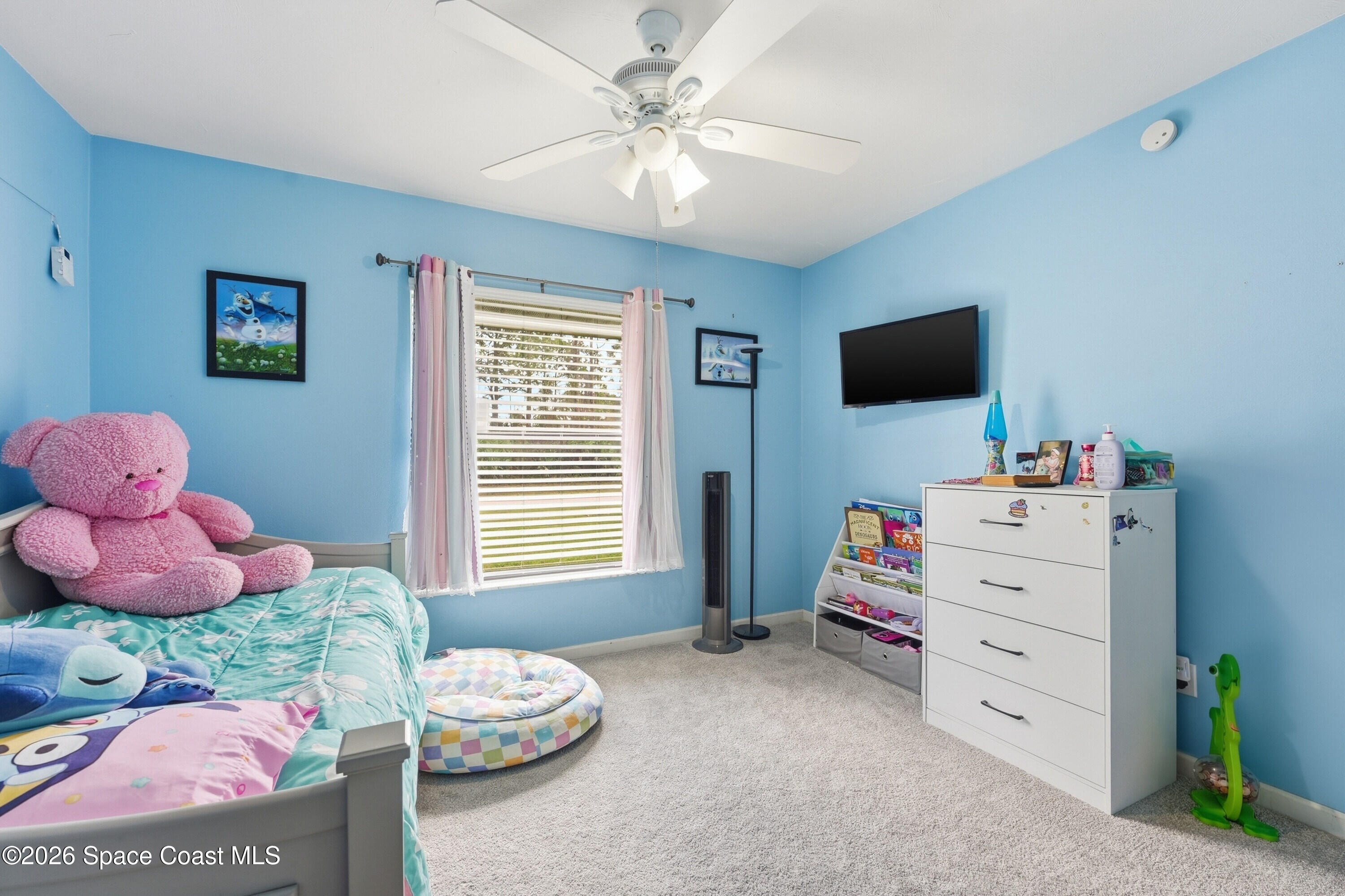 830 Garvey Road Palm Bay, FL 32908 - Photo 24 of 48 a bedroom with a bed and a window