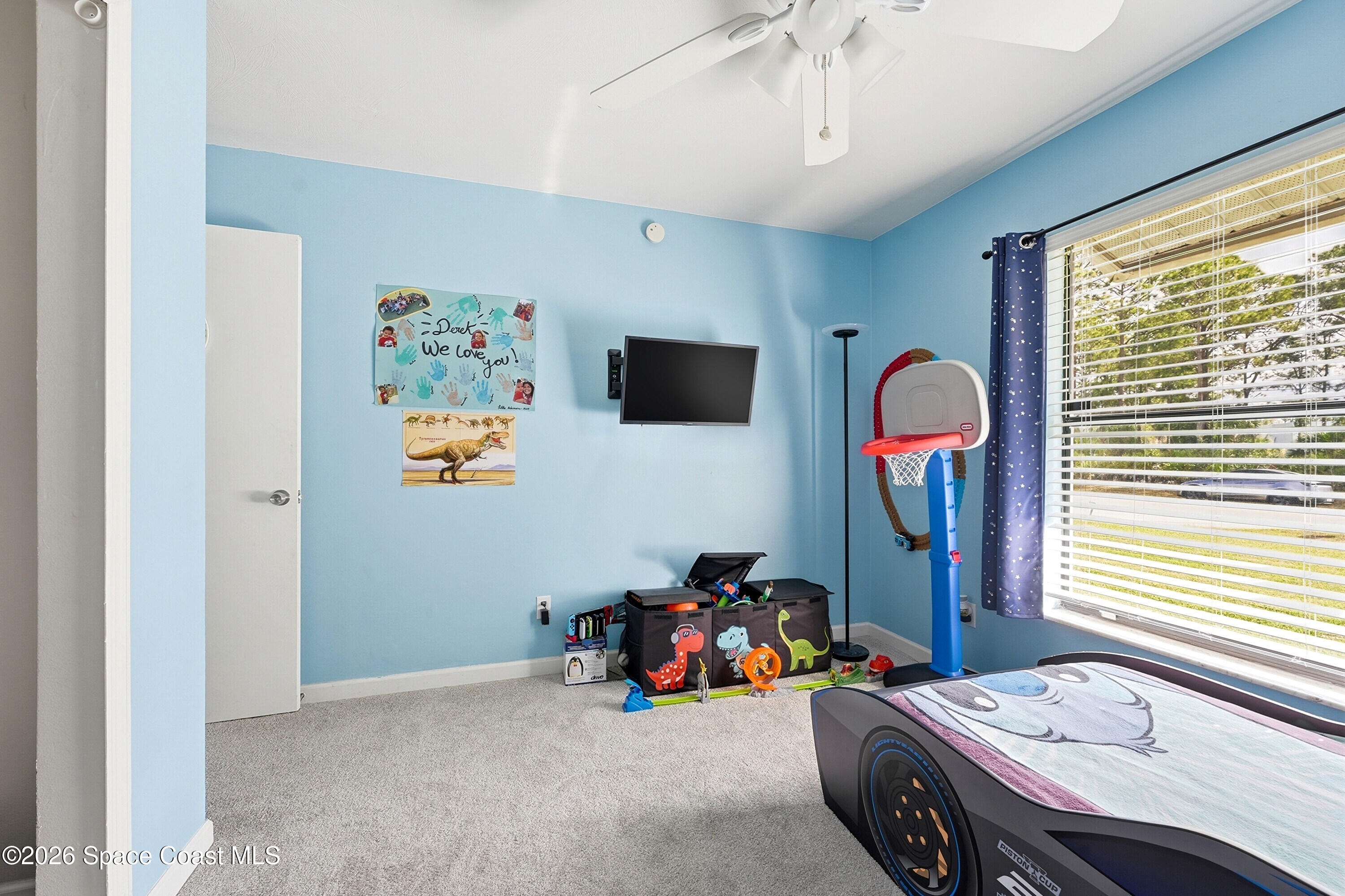 830 Garvey Road Palm Bay, FL 32908 - Photo 26 of 48 a view of a livingroom with furniture and window