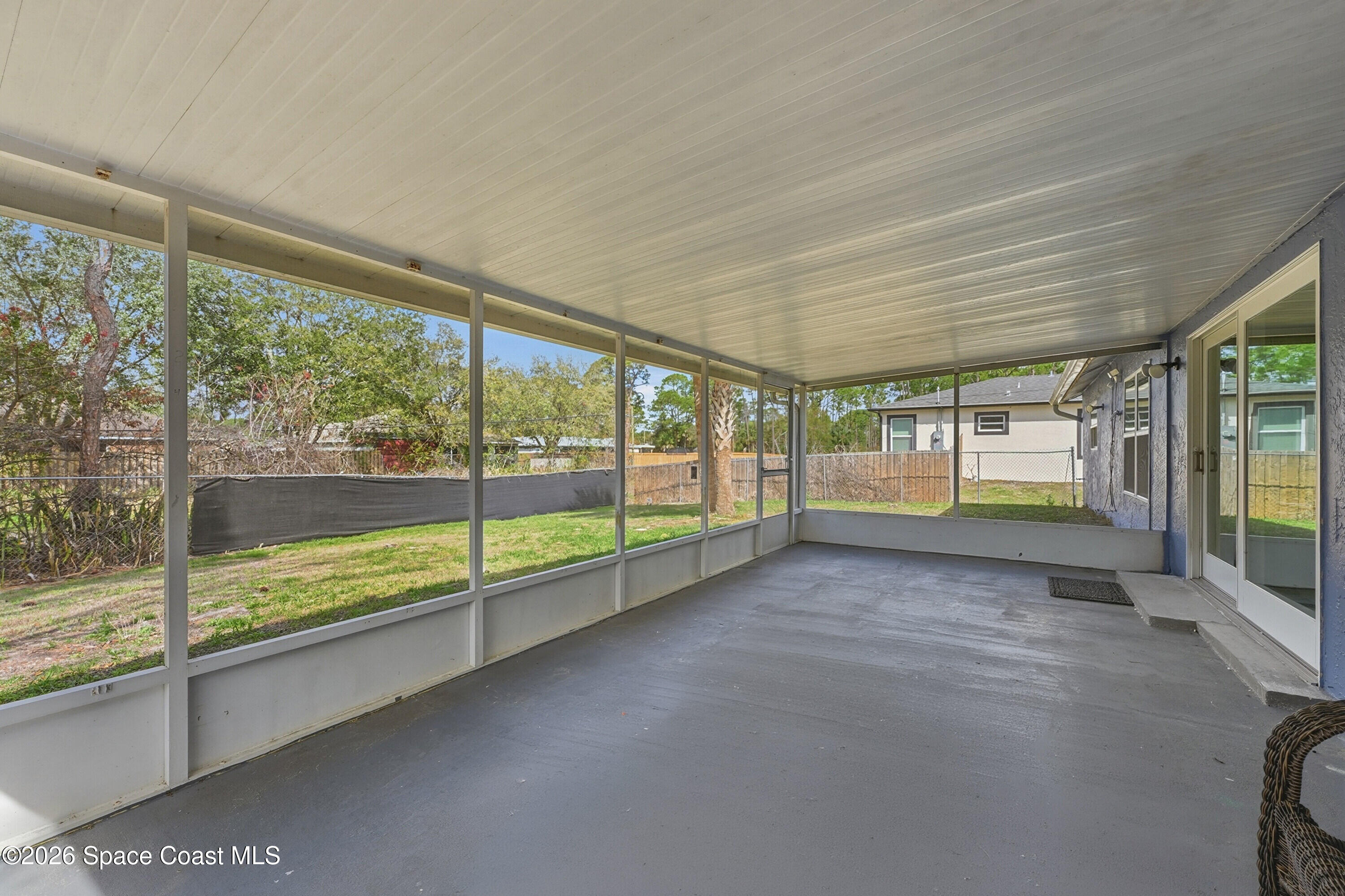 830 Garvey Road Palm Bay, FL 32908 - Photo 31 of 48 a view of an empty room with a balcony