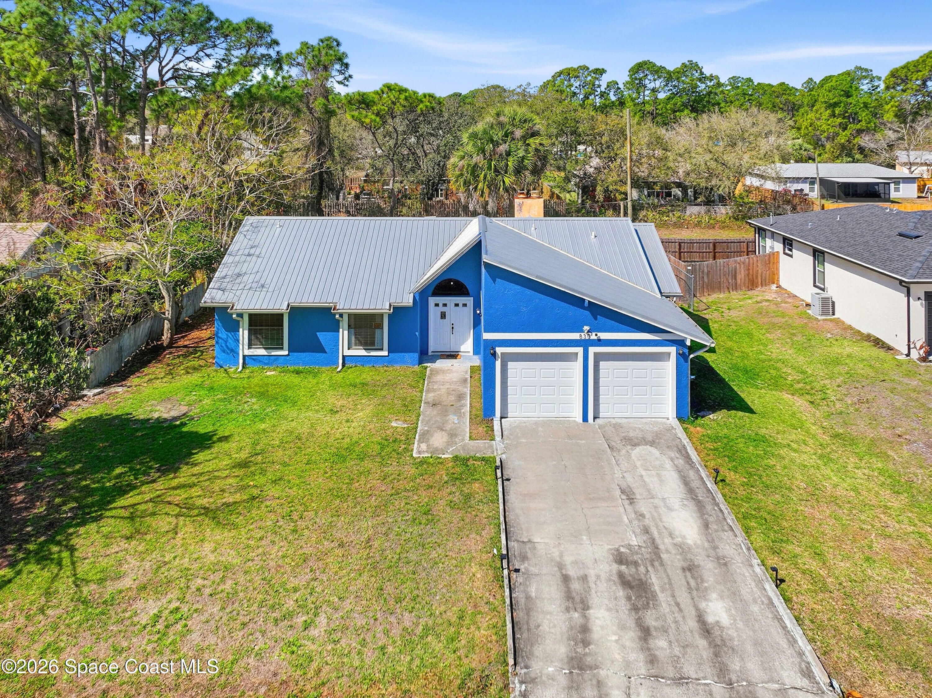 830 Garvey Road Palm Bay, FL 32908 - Photo 36 of 48 a view of house with garden