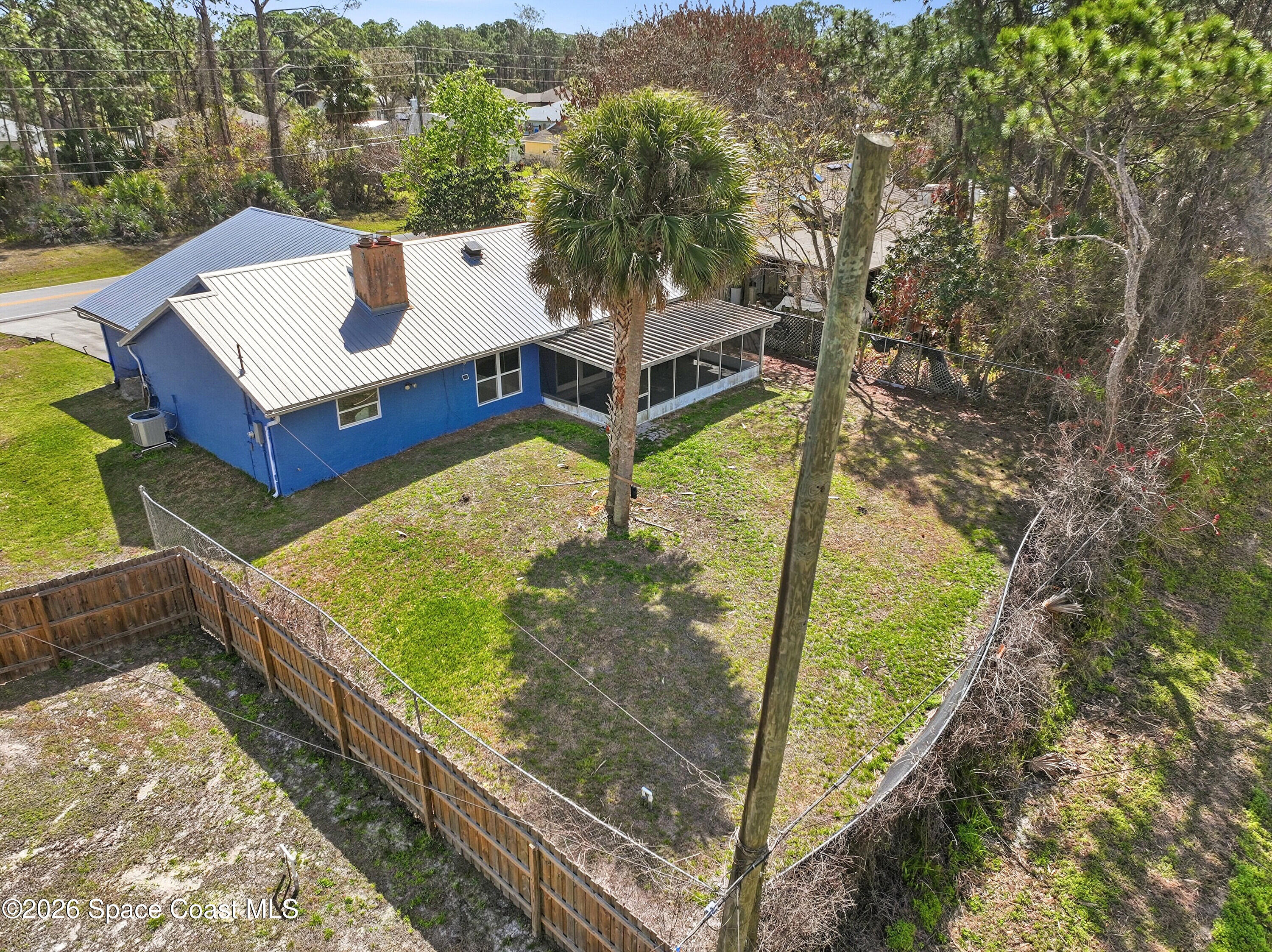 830 Garvey Road Palm Bay, FL 32908 - Photo 40 of 48 a view of a two chairs in the balcony