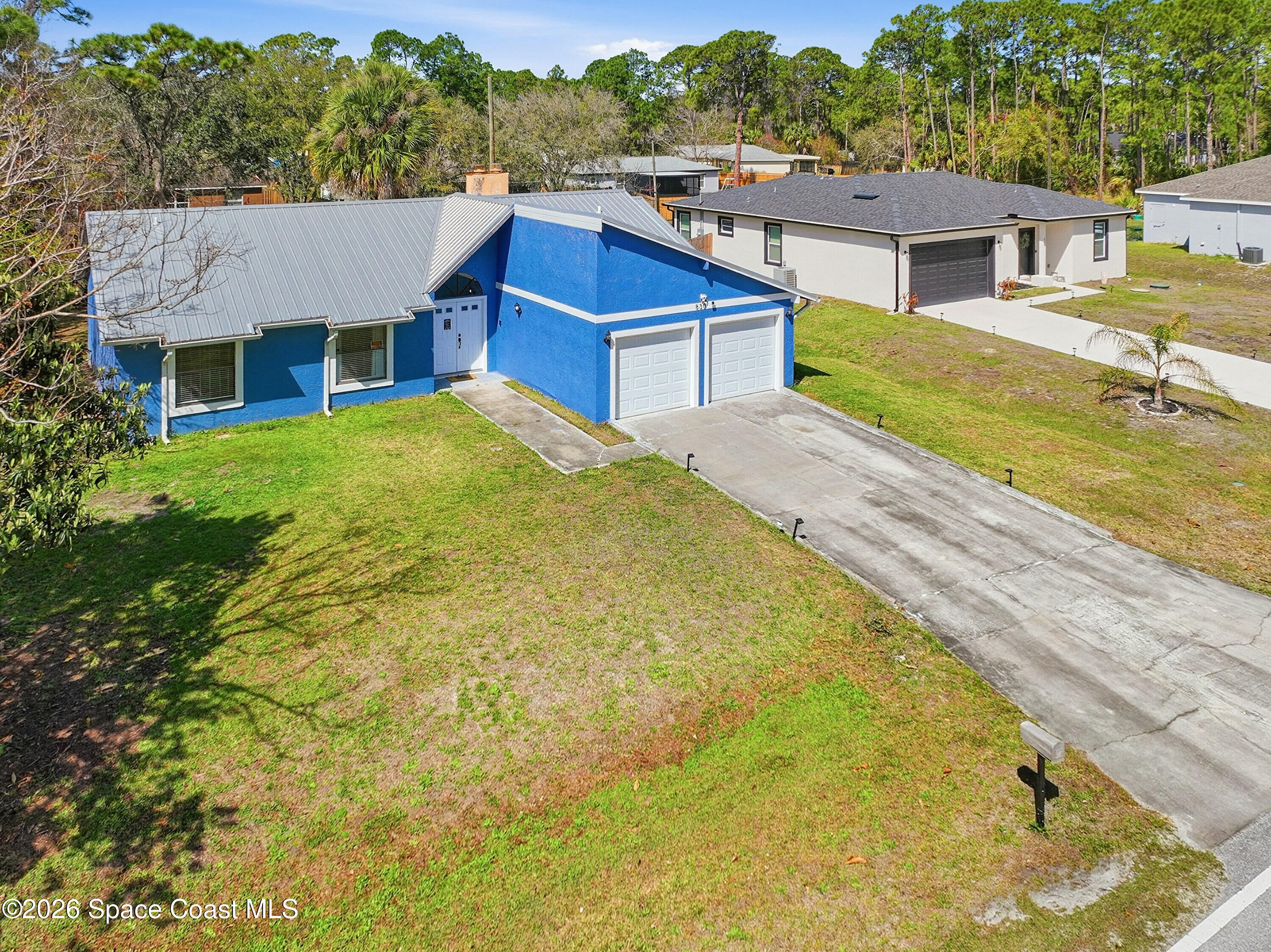 830 Garvey Road Palm Bay, FL 32908 - Photo 42 of 48 a aerial view of a house with pool