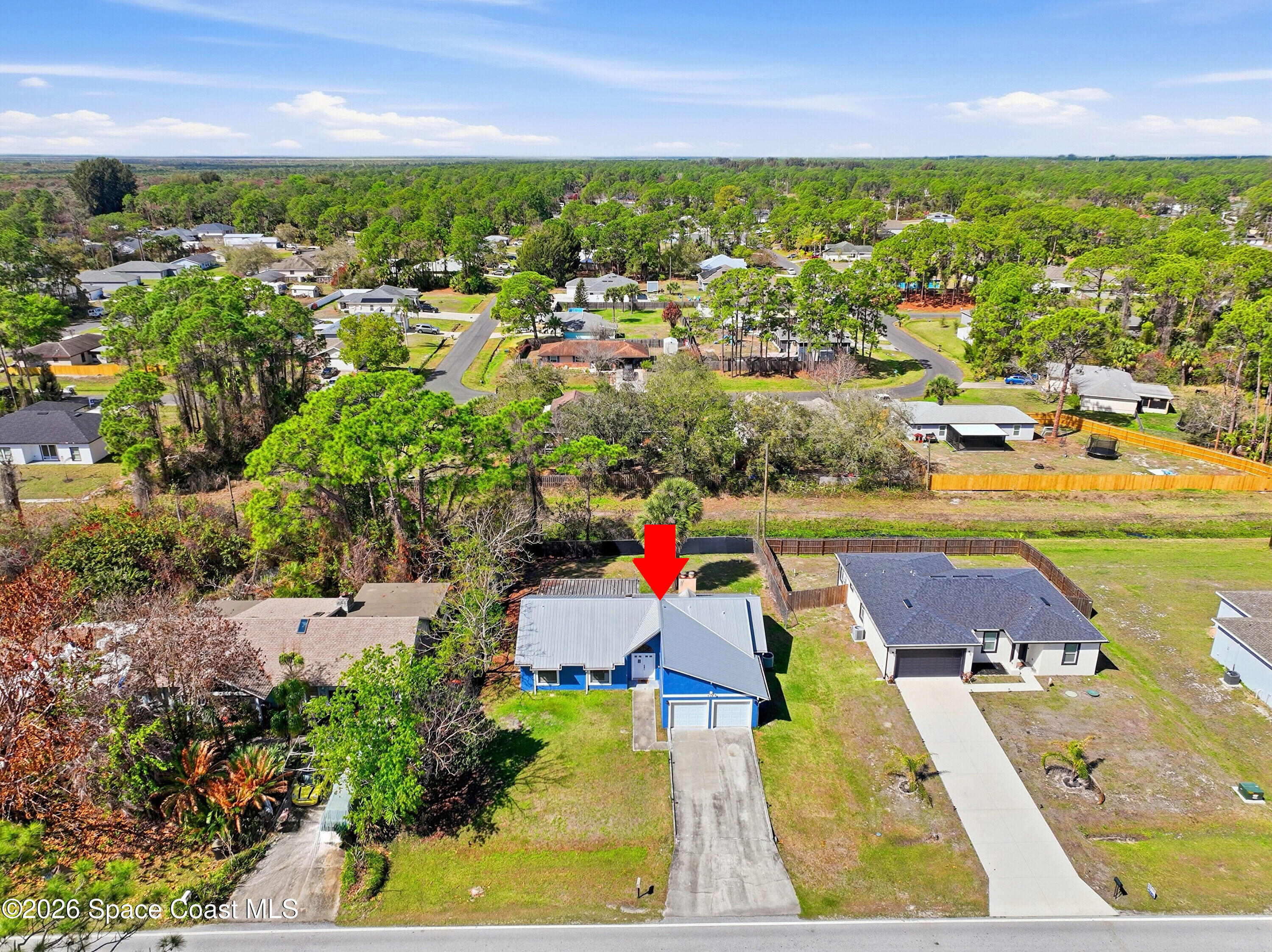 830 Garvey Road Palm Bay, FL 32908 - Photo 43 of 48 an aerial view of residential houses with outdoor space