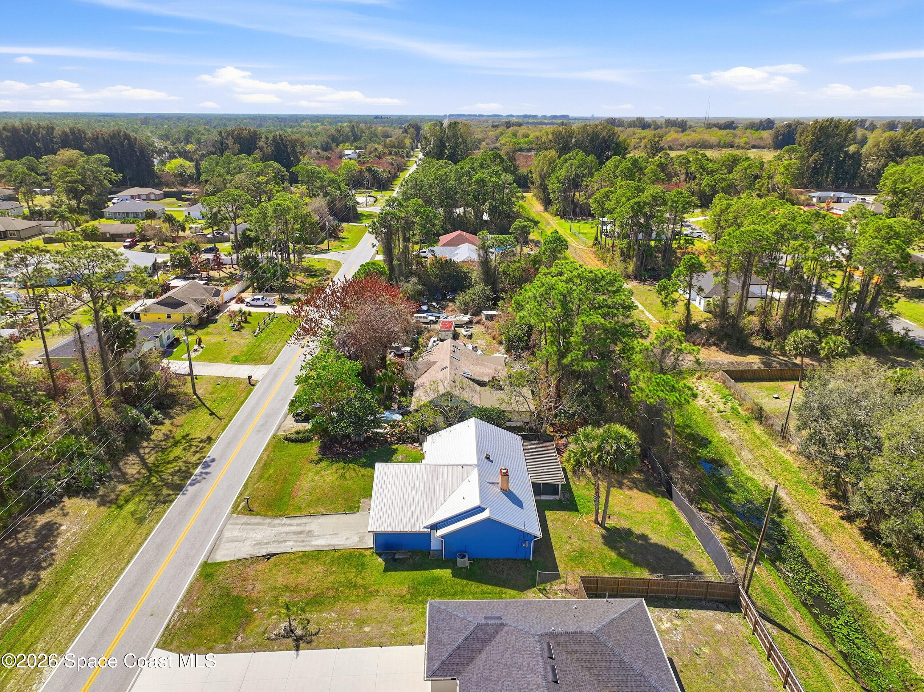 830 Garvey Road Palm Bay, FL 32908 - Photo 44 of 48 an aerial view of residential houses with outdoor space