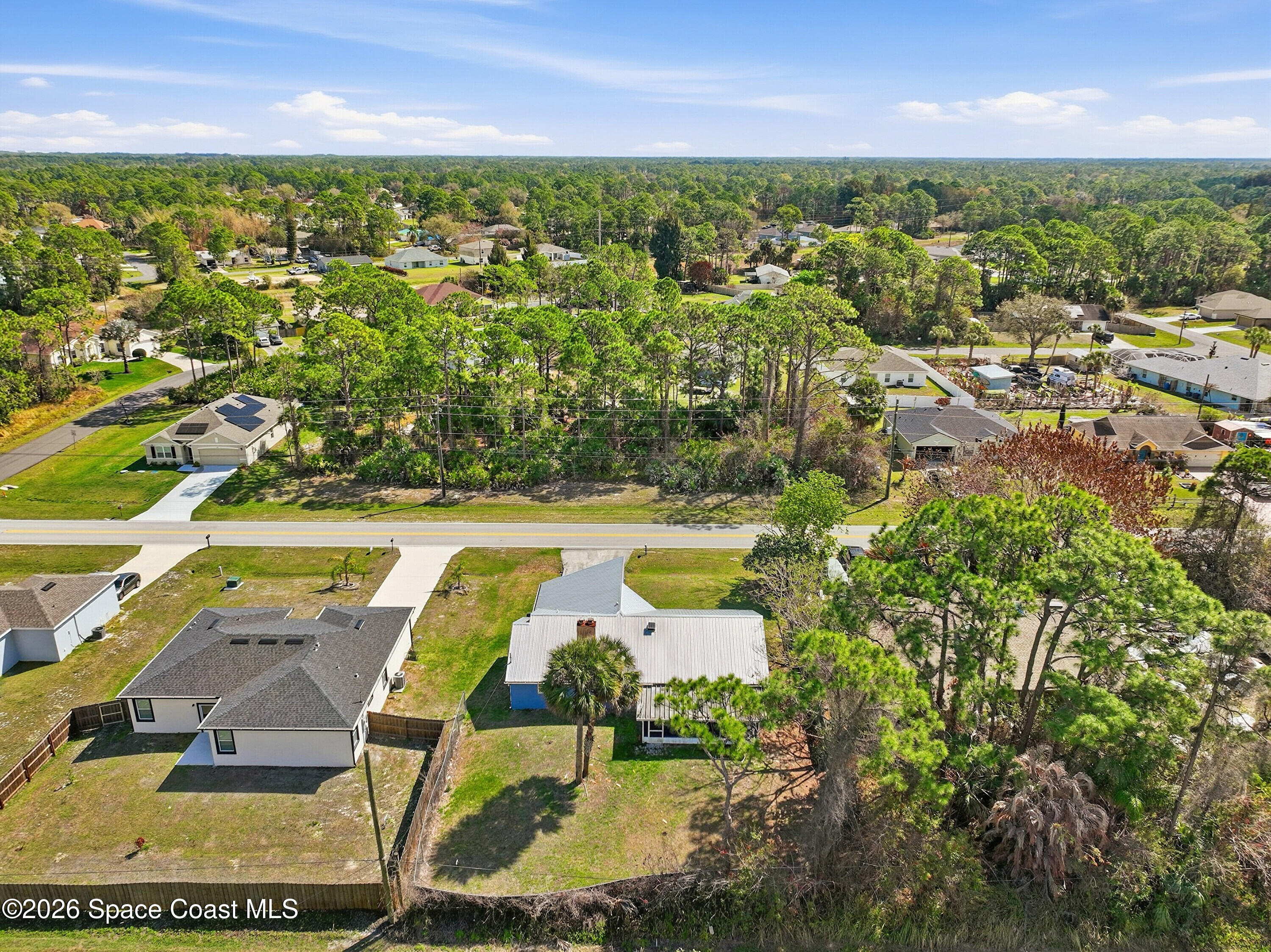 830 Garvey Road Palm Bay, FL 32908 - Photo 45 of 48 an aerial view of residential houses with outdoor space and swimming pool