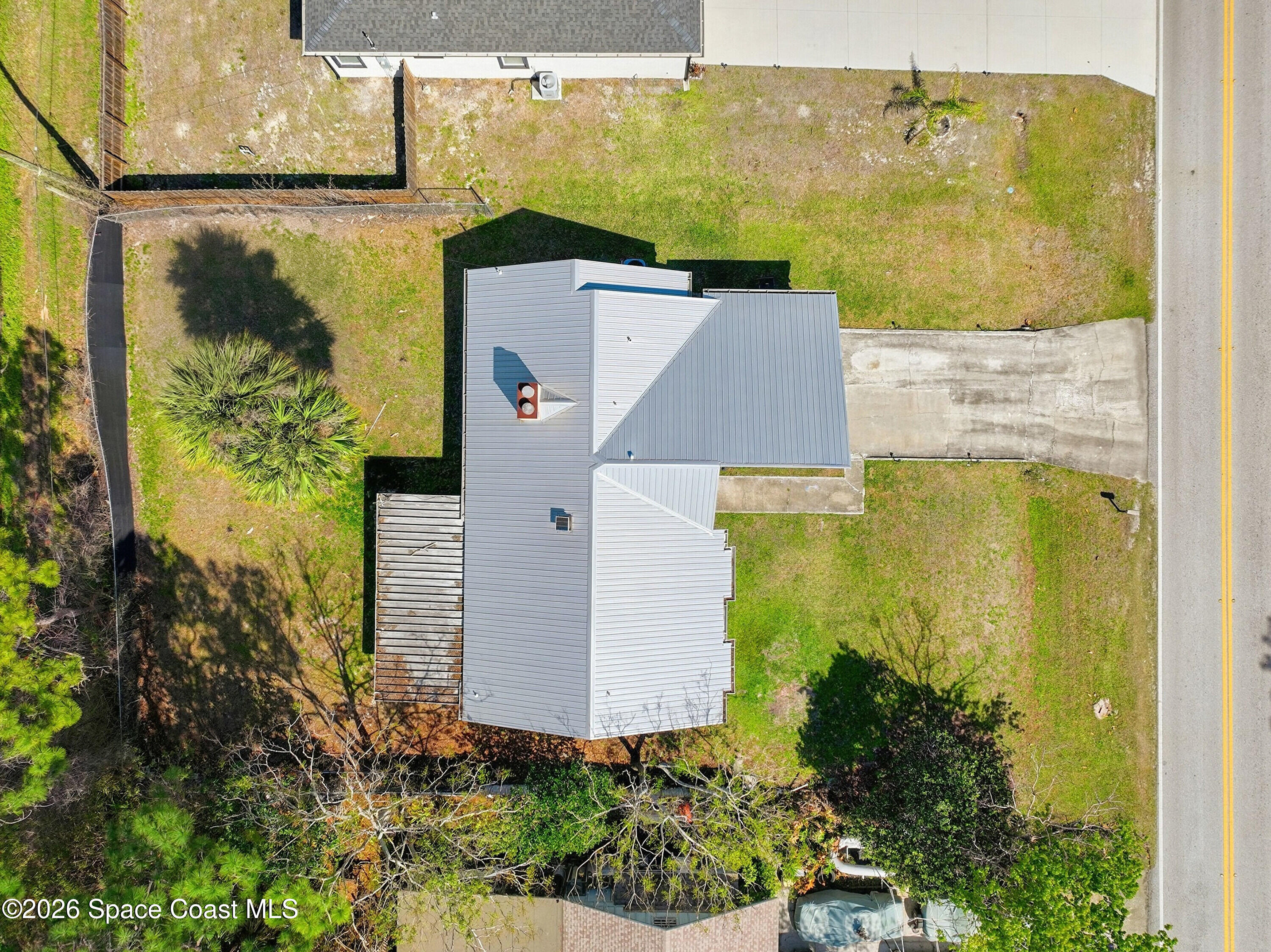 830 Garvey Road Palm Bay, FL 32908 - Photo 47 of 48 aerial view of a house with a yard