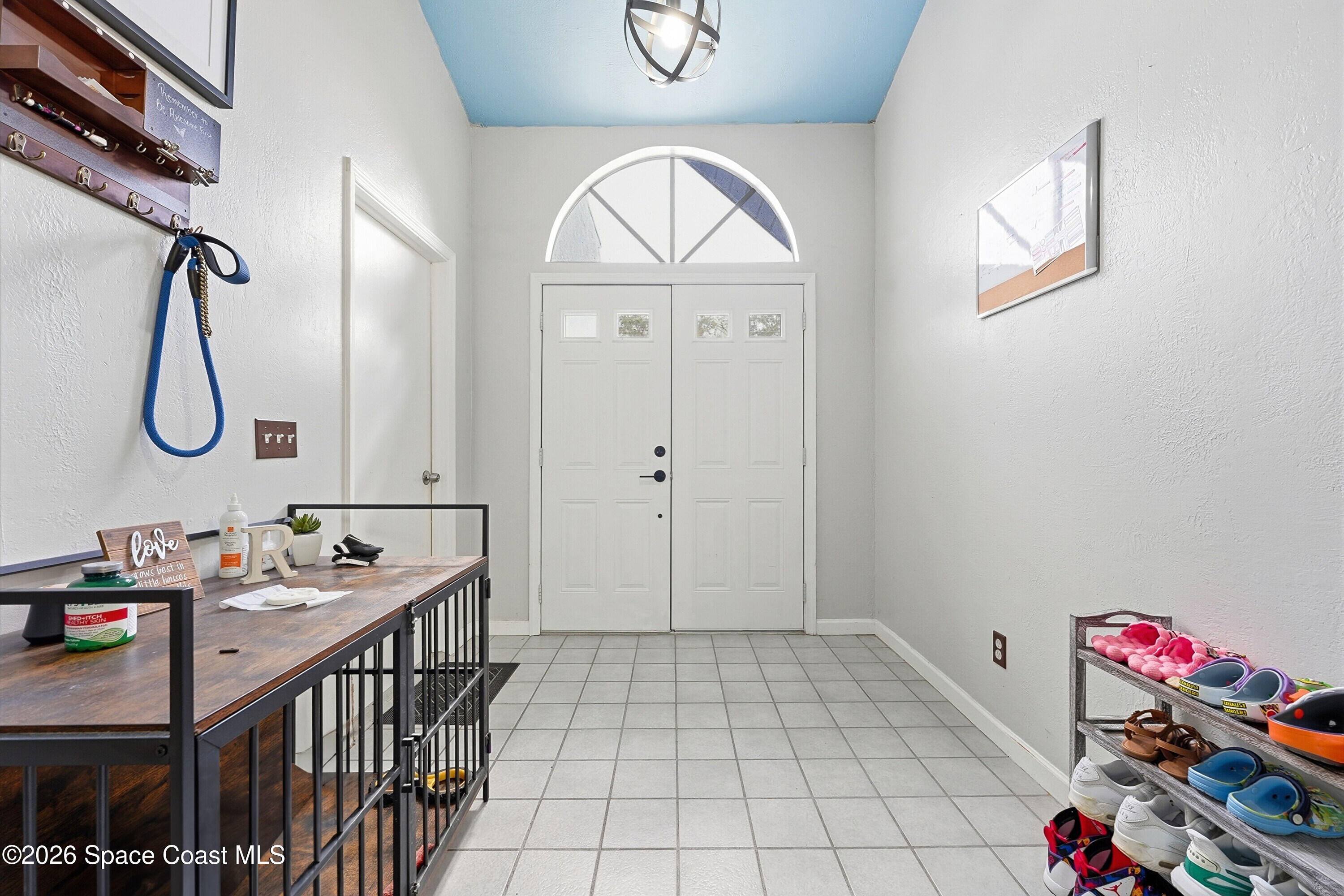 830 Garvey Road Palm Bay, FL 32908 - Photo 7 of 48 a view of an entryway with wooden floor