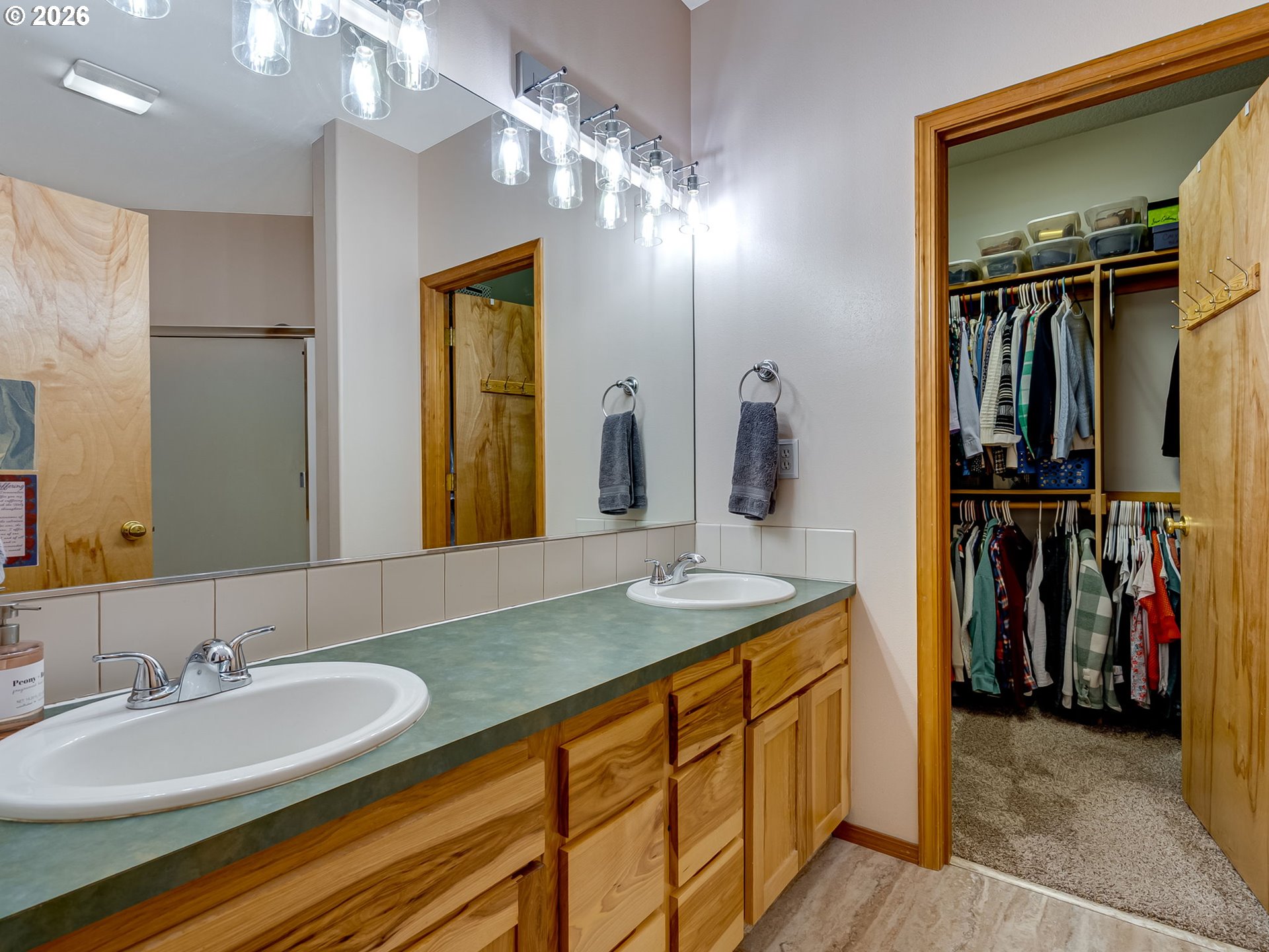 22967 South Day Hill Road Estacada, OR 97023 - Photo 18 of 40 a bathroom with a double vanity sink and a mirror