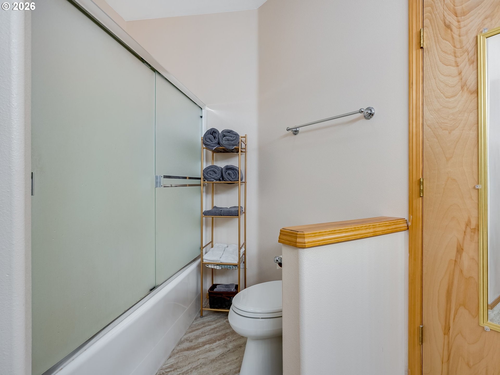 22967 South Day Hill Road Estacada, OR 97023 - Photo 19 of 40 a bathroom with a toilet and a shower curtain
