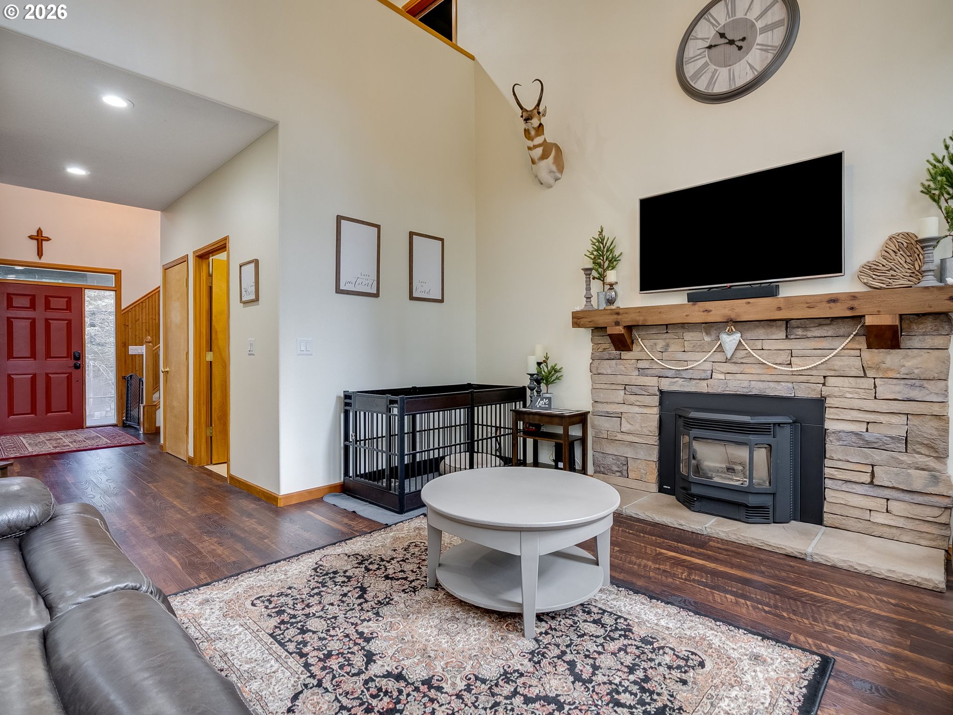 22967 South Day Hill Road Estacada, OR 97023 - Photo 23 of 40 a living room with furniture a flat screen tv and a fireplace