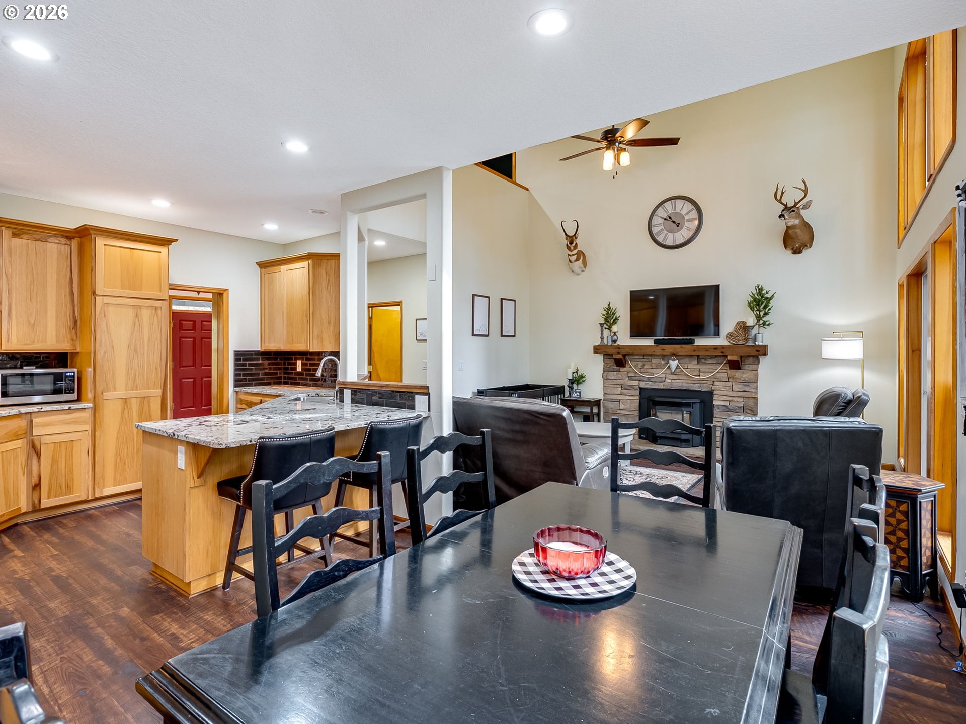 22967 South Day Hill Road Estacada, OR 97023 - Photo 24 of 40 a view of a dining room with furniture a kitchen and chandelier