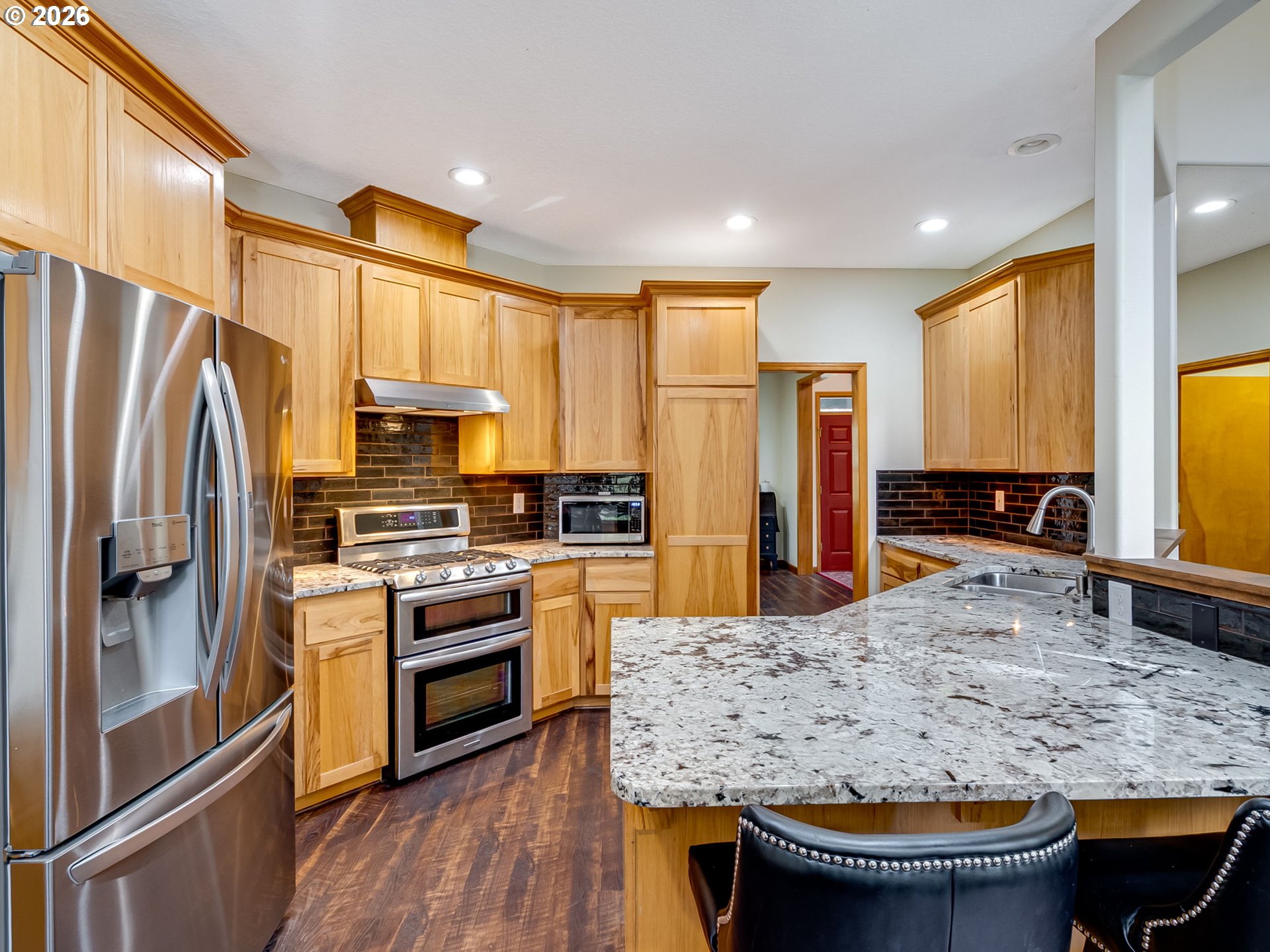 22967 South Day Hill Road Estacada, OR 97023 - Photo 25 of 40 a kitchen with stainless steel appliances granite countertop a refrigerator a stove and a sink