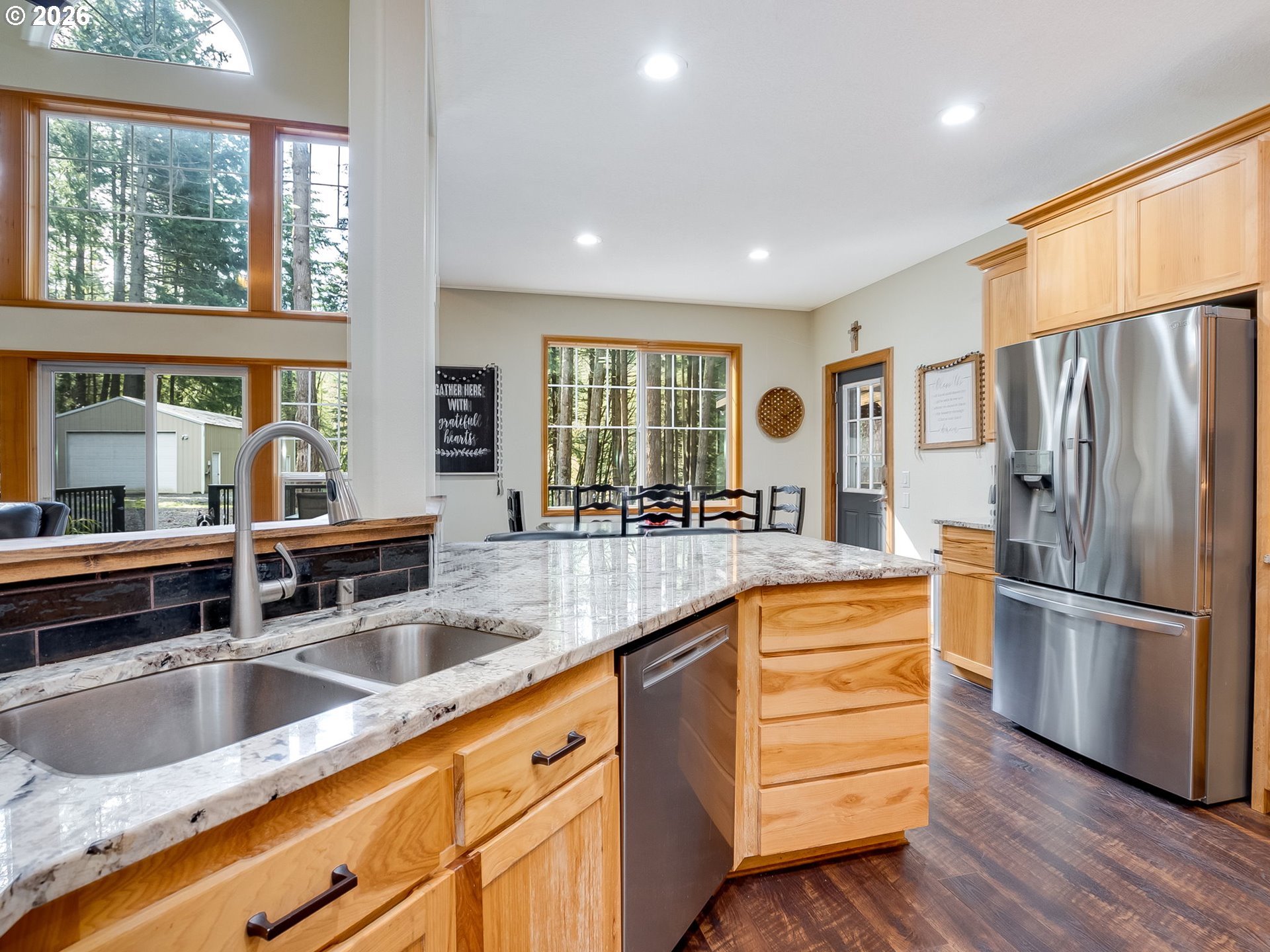 22967 South Day Hill Road Estacada, OR 97023 - Photo 27 of 40 a kitchen with stainless steel appliances granite countertop a sink stove and refrigerator