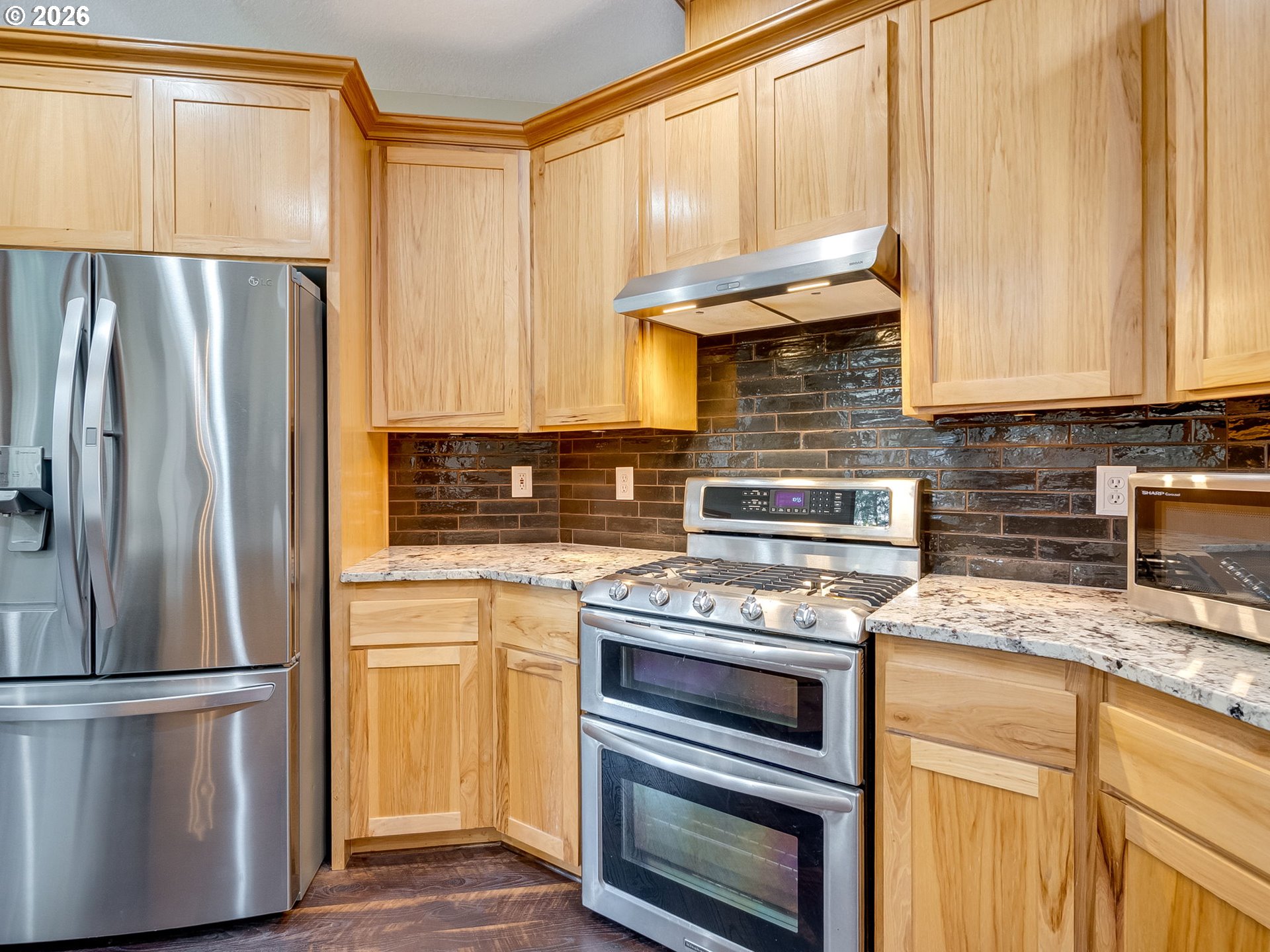22967 South Day Hill Road Estacada, OR 97023 - Photo 28 of 40 a kitchen with appliances a refrigerator and cabinets