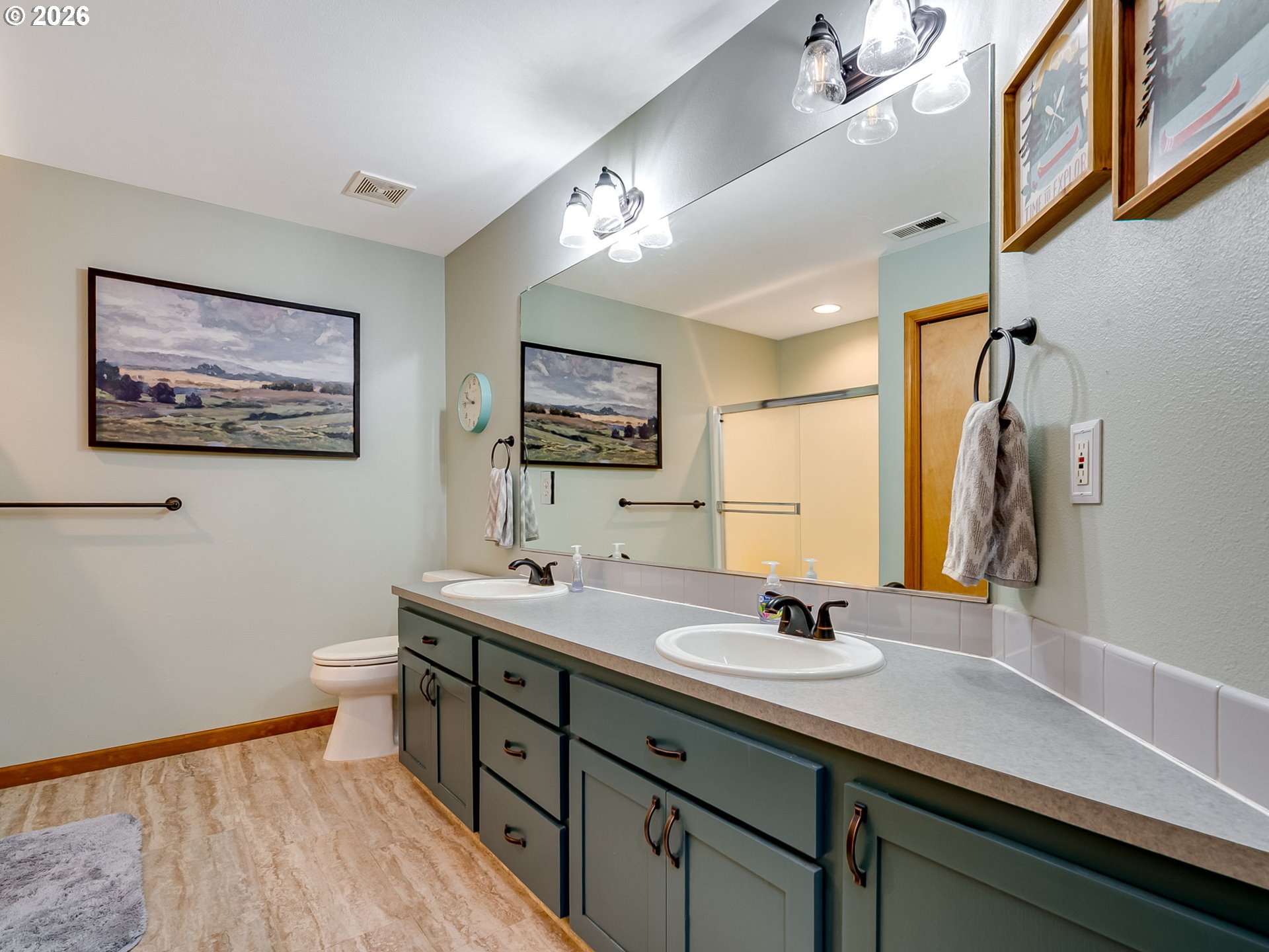 22967 South Day Hill Road Estacada, OR 97023 - Photo 33 of 40 a bathroom with a double vanity sink and a mirror