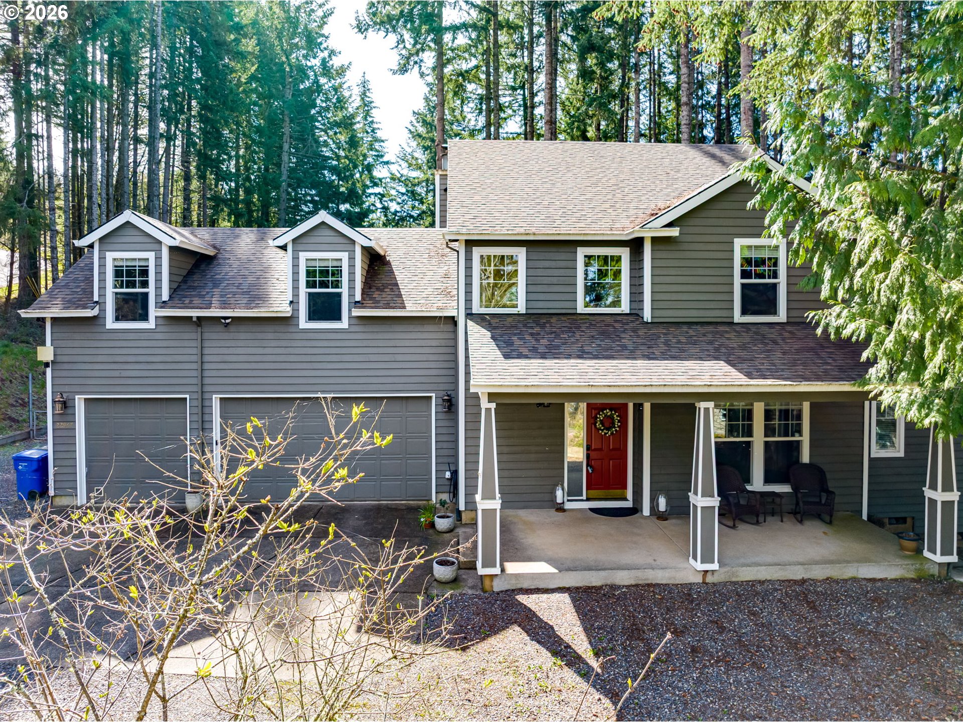 22967 South Day Hill Road Estacada, OR 97023 - Photo 38 of 40 a view of a brick house with large windows and a small yard