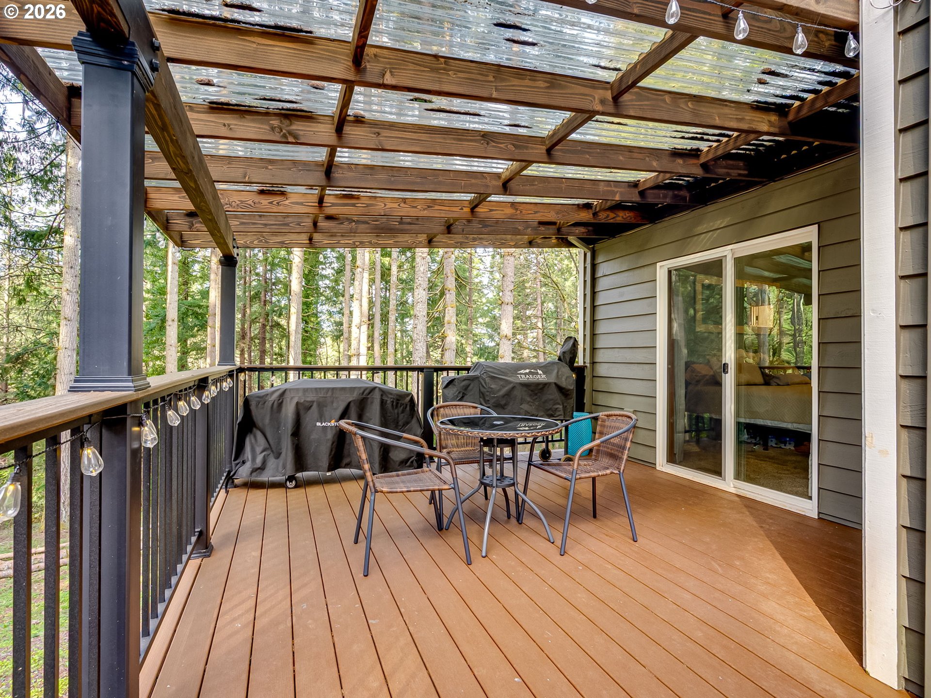 22967 South Day Hill Road Estacada, OR 97023 - Photo 5 of 40 a view of a balcony with chairs and wooden floor