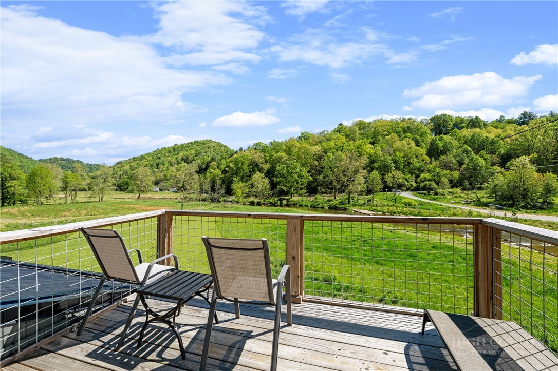 634-636 Watauga River Road Sugar Grove, NC 28679 - Photo 30 of 50 a view of a chair and table on the terrace