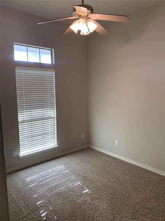 9004 Pink Pearl Court Shreveport, LA 71115 - Photo 4 of 10 an empty room with windows and fan
