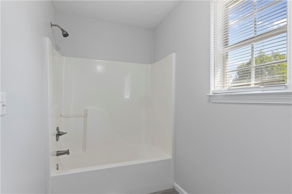 150 Fairclift Drive Covington, GA 30016 - Photo 16 of 22 a bathroom with a bathtub