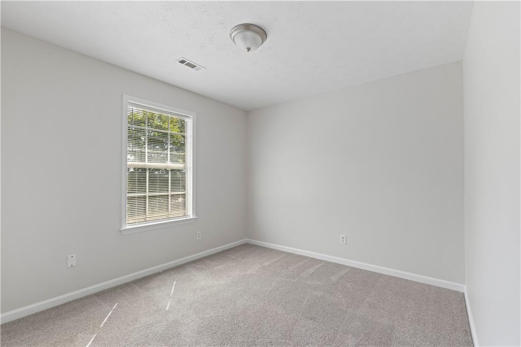 150 Fairclift Drive Covington, GA 30016 - Photo 17 of 22 an empty room with a window