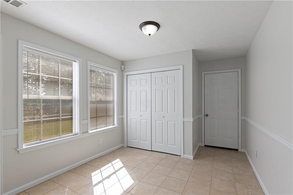 150 Fairclift Drive Covington, GA 30016 - Photo 8 of 22 a view of empty room with windows