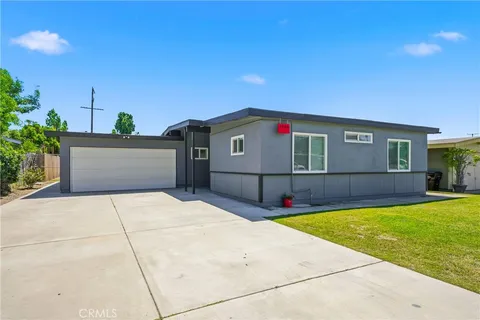 a front view of house with yard and entertaining space
