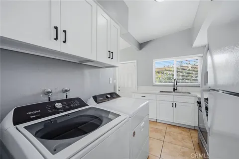a kitchen that has a sink and a stove