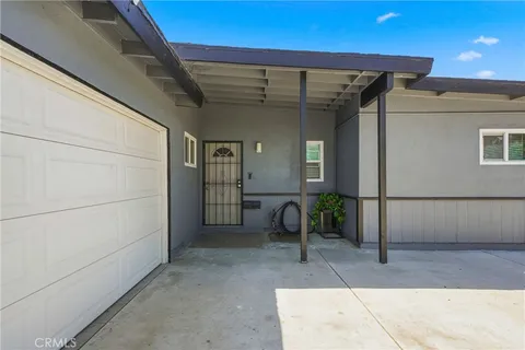 a view of a porch with seating space