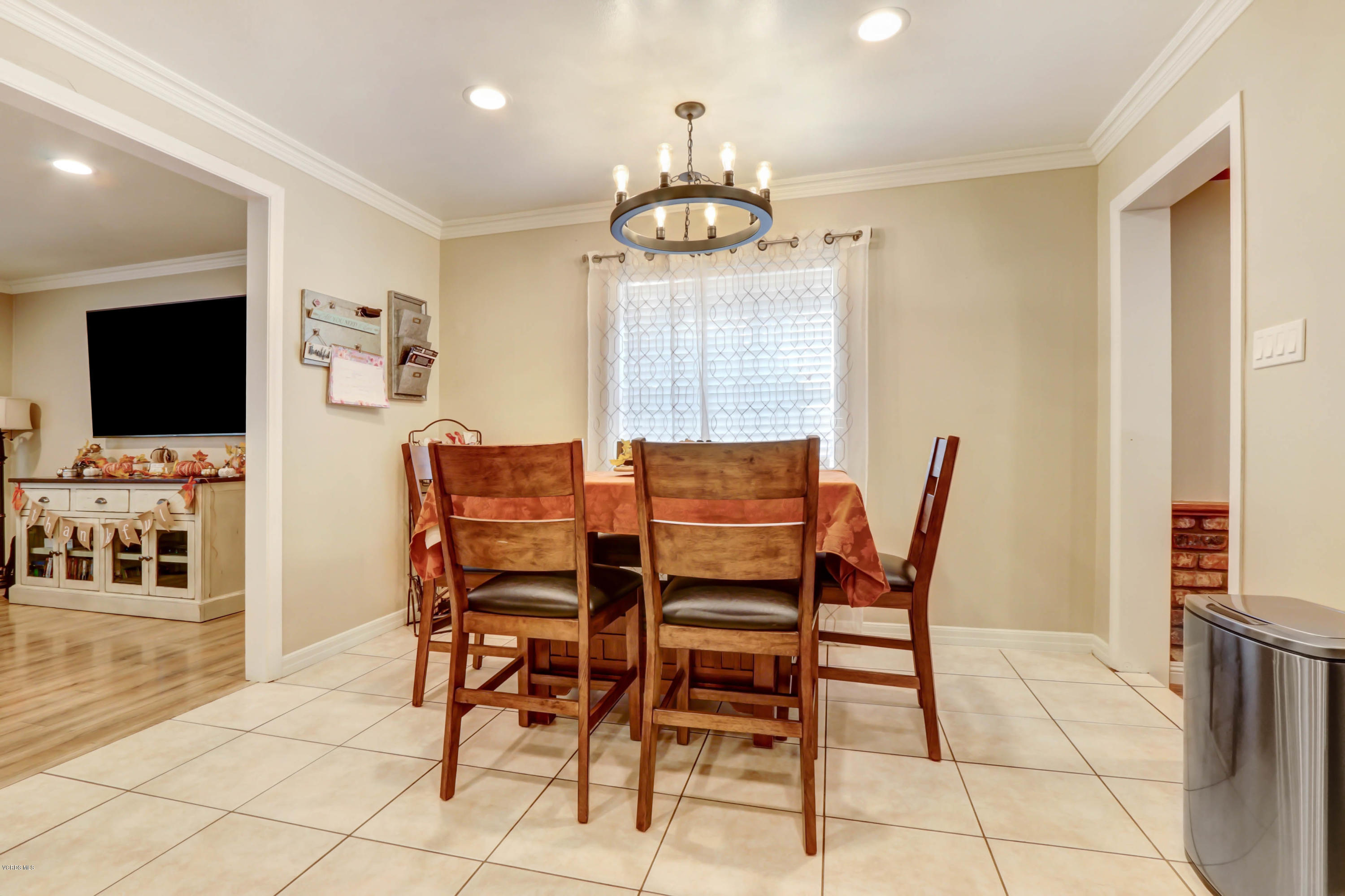 6205 Melia Street Simi Valley, CA 93063 - Photo 16 of 36 a dining room with furniture and wooden floor