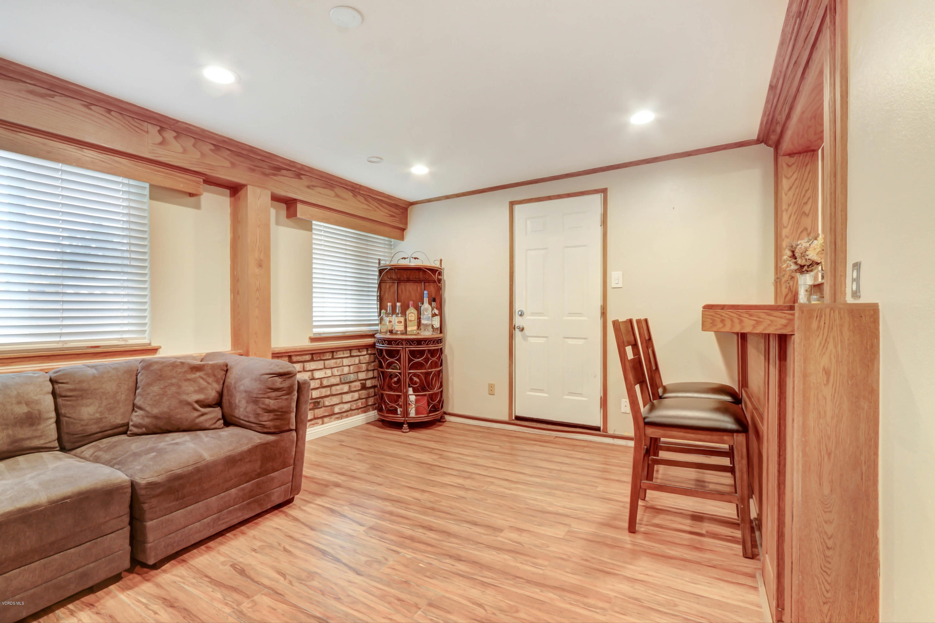 6205 Melia Street Simi Valley, CA 93063 - Photo 17 of 36 a living room with furniture and a wooden floor